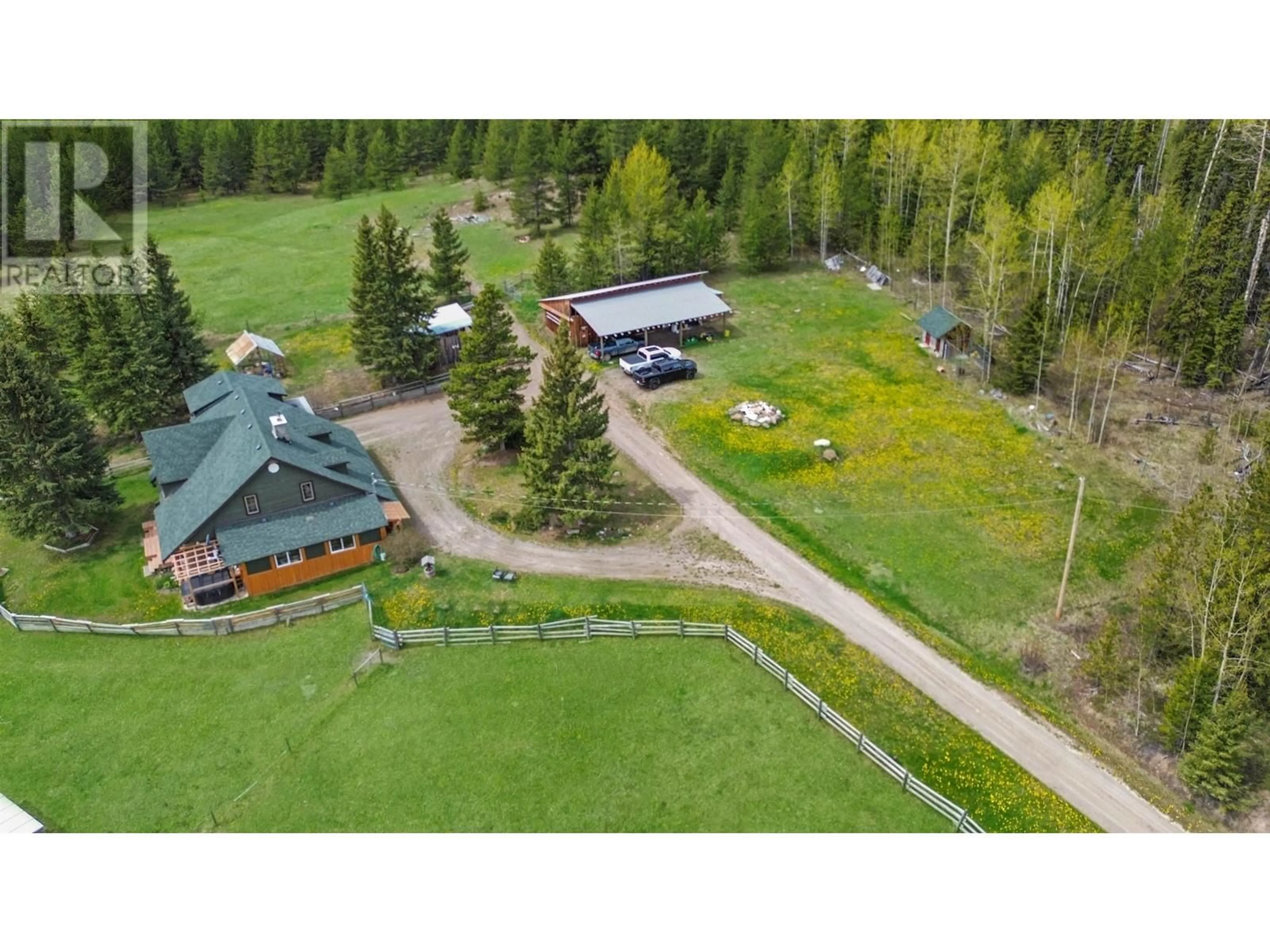 A pic from outside/outdoor area/front of a property/back of a property/a pic from drone, mountain view for 4050 SPOKIN LAKE ROAD, 150 Mile House British Columbia V0K2G0