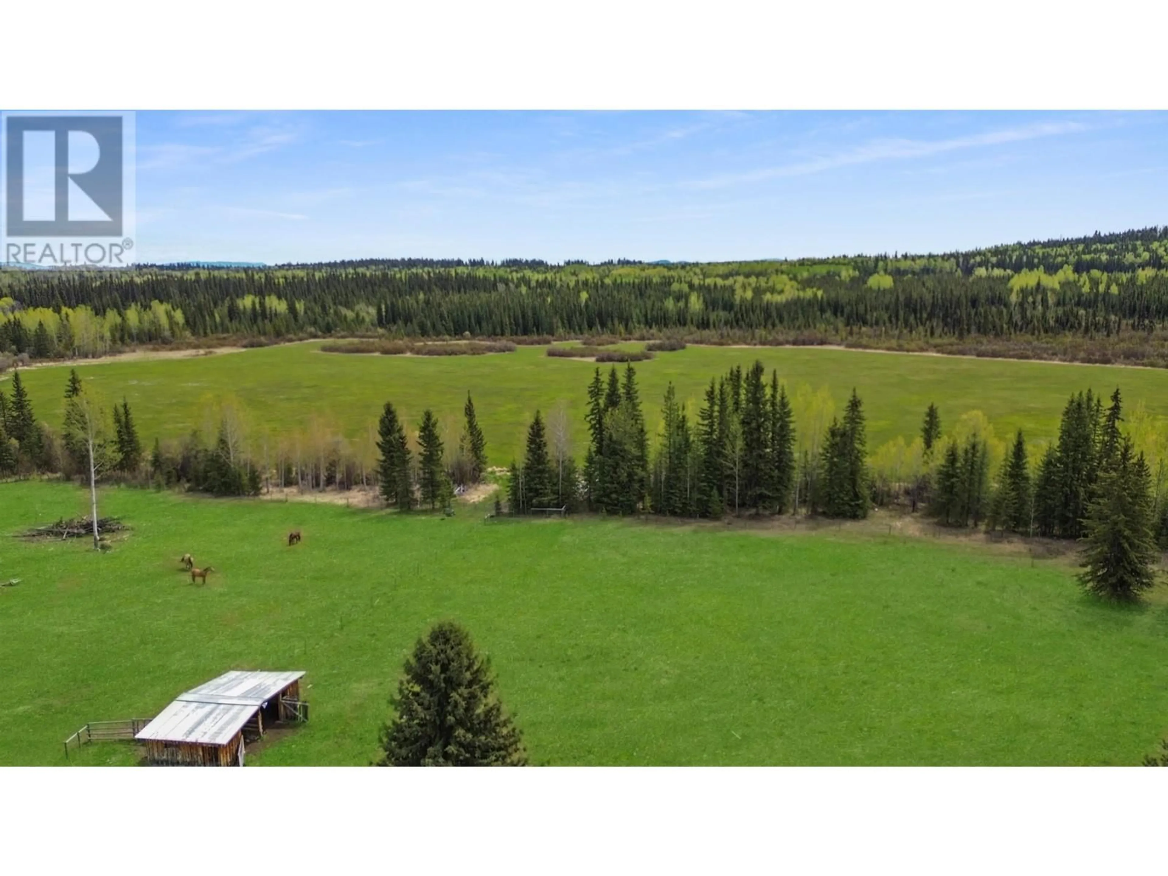 A pic from outside/outdoor area/front of a property/back of a property/a pic from drone, forest/trees view for 4050 SPOKIN LAKE ROAD, 150 Mile House British Columbia V0K2G0