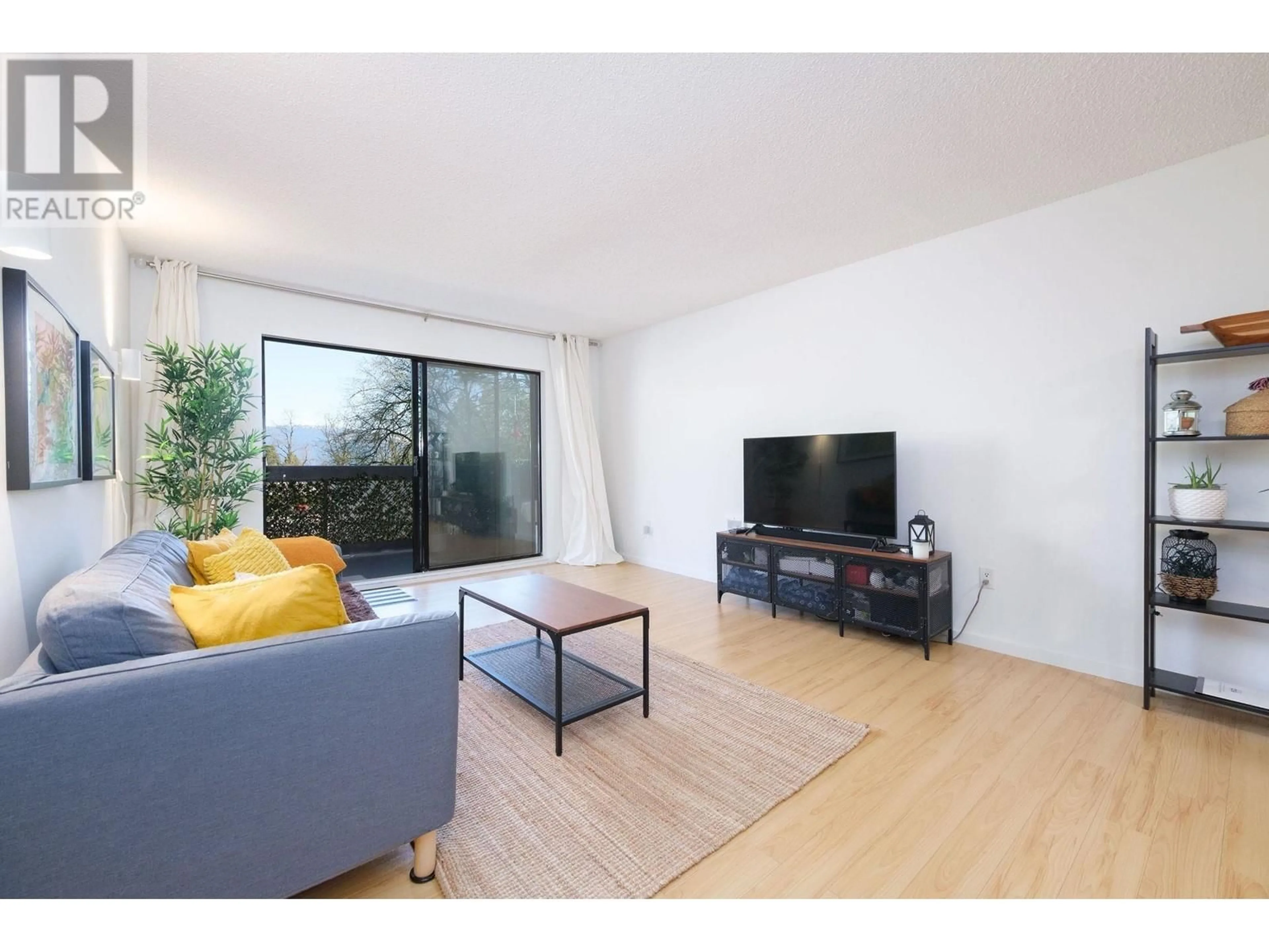 Living room with furniture, wood/laminate floor for 301 - 6105 KINGSWAY, Burnaby British Columbia V5J5C7