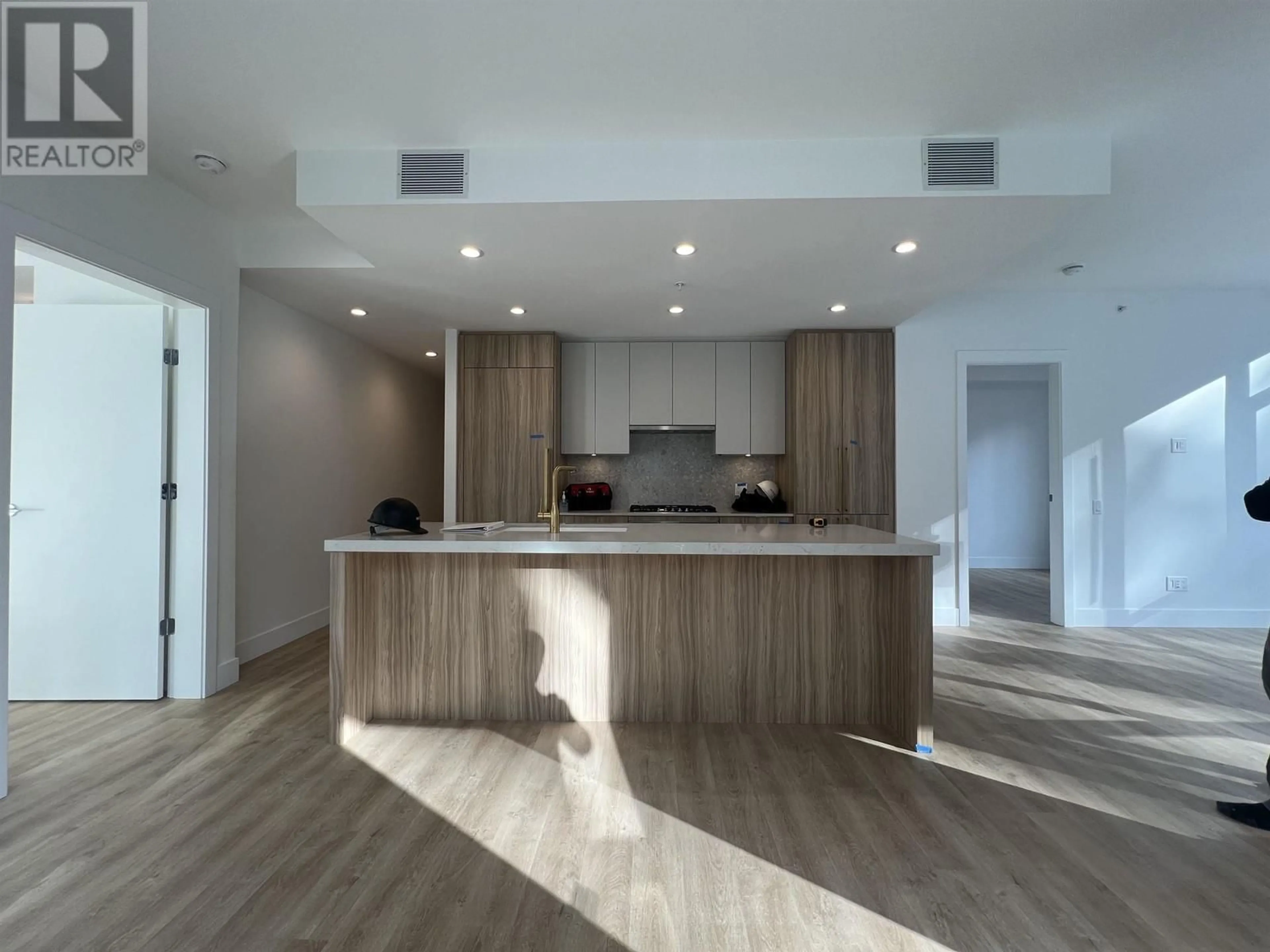 Open concept kitchen, wood/laminate floor for 403 - 2385 EMERY COURT, North Vancouver British Columbia V7J0G1
