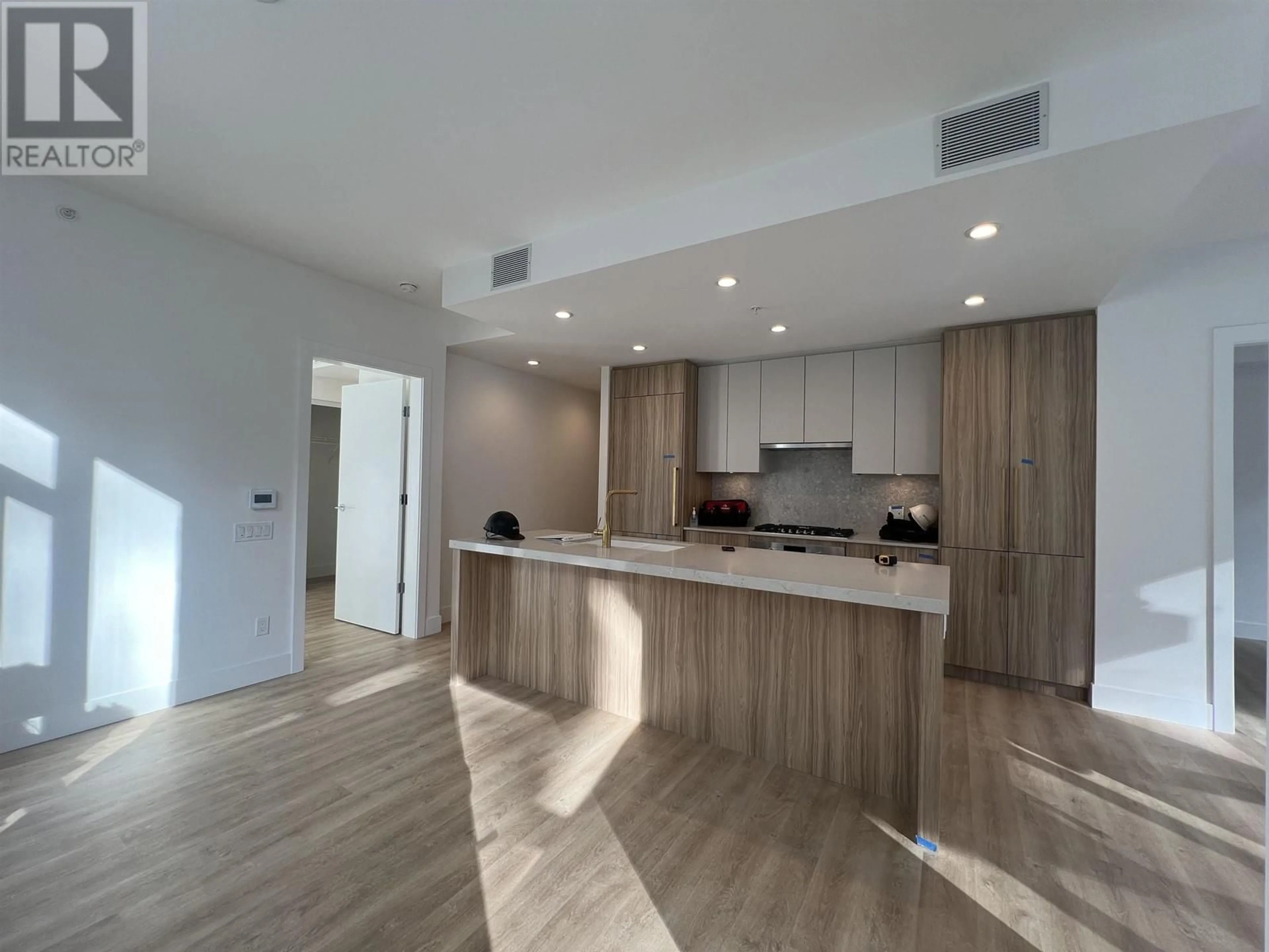 Open concept kitchen, wood/laminate floor for 403 - 2385 EMERY COURT, North Vancouver British Columbia V7J0G1