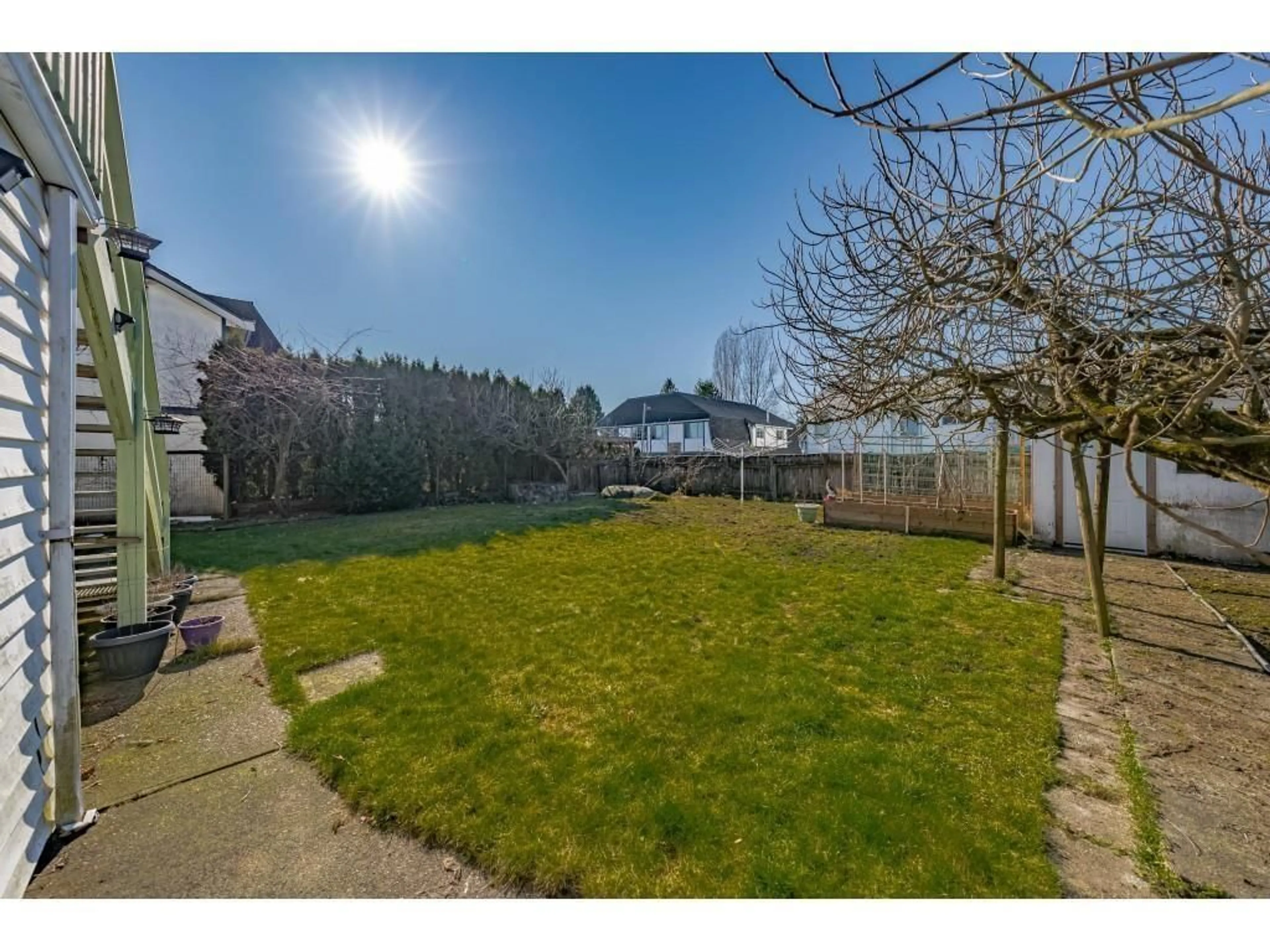 A pic from outside/outdoor area/front of a property/back of a property/a pic from drone, water/lake/river/ocean view for 9445 154, Surrey British Columbia V3R9E2