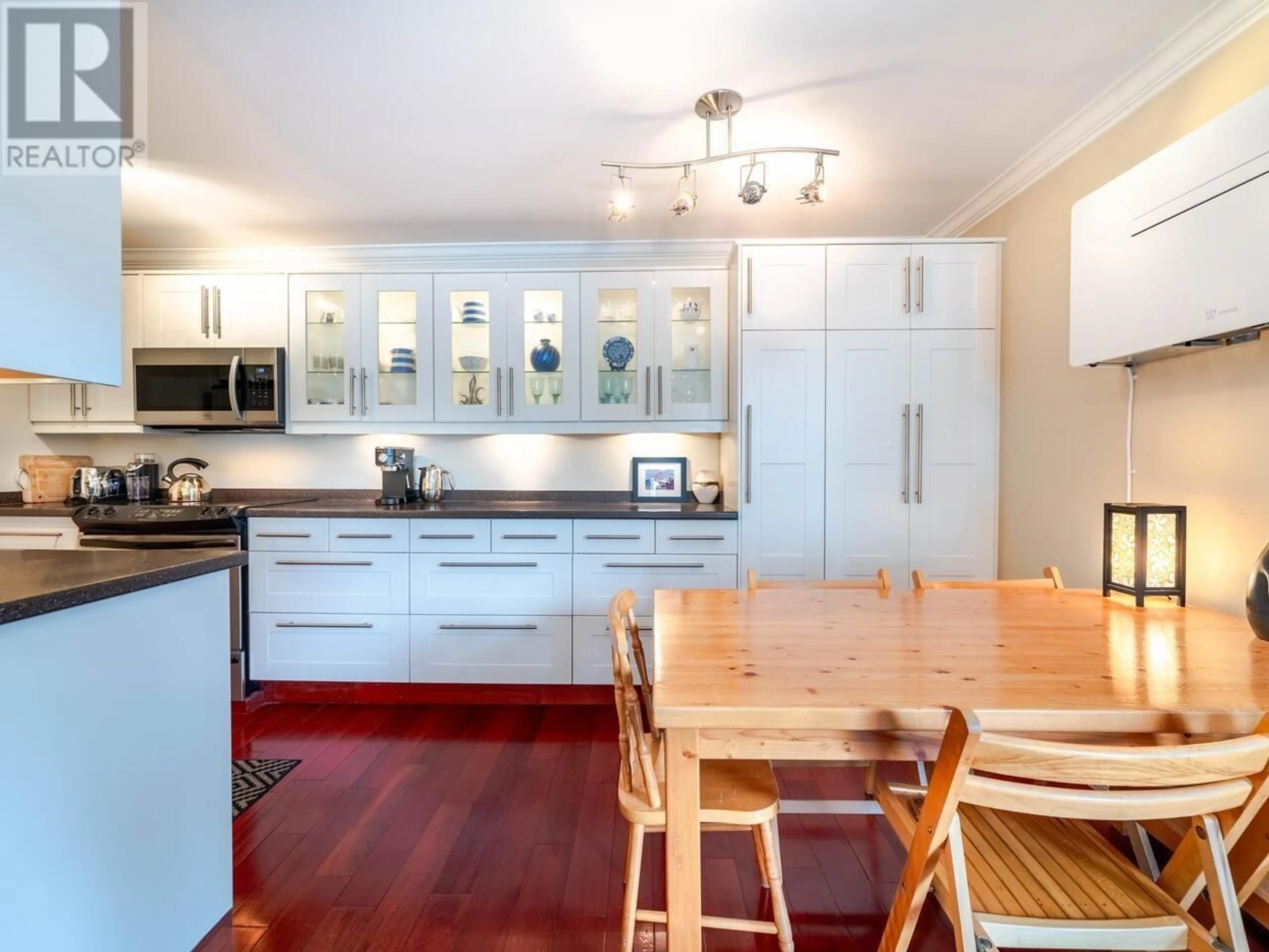 Open concept kitchen, wood/laminate floor for 204 - 777 7TH AVENUE, Vancouver British Columbia V5Z1B9