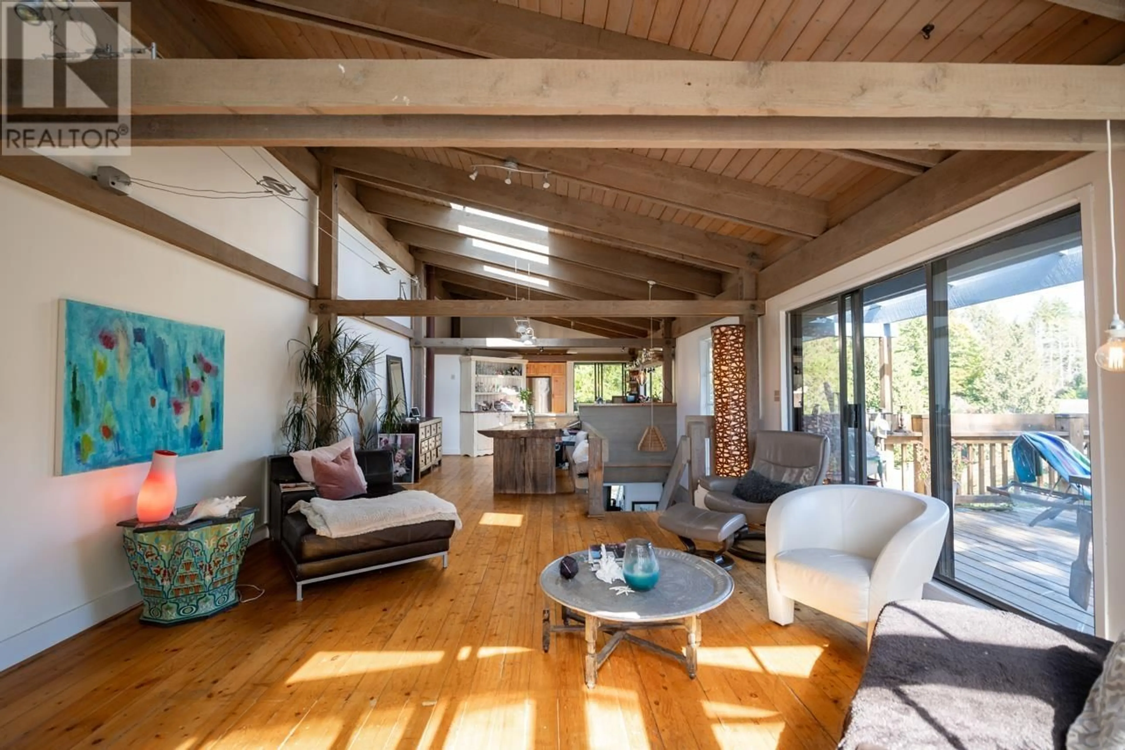 Living room with furniture, wood/laminate floor for 4477 STRATHCONA ROAD, North Vancouver British Columbia V7G1G7