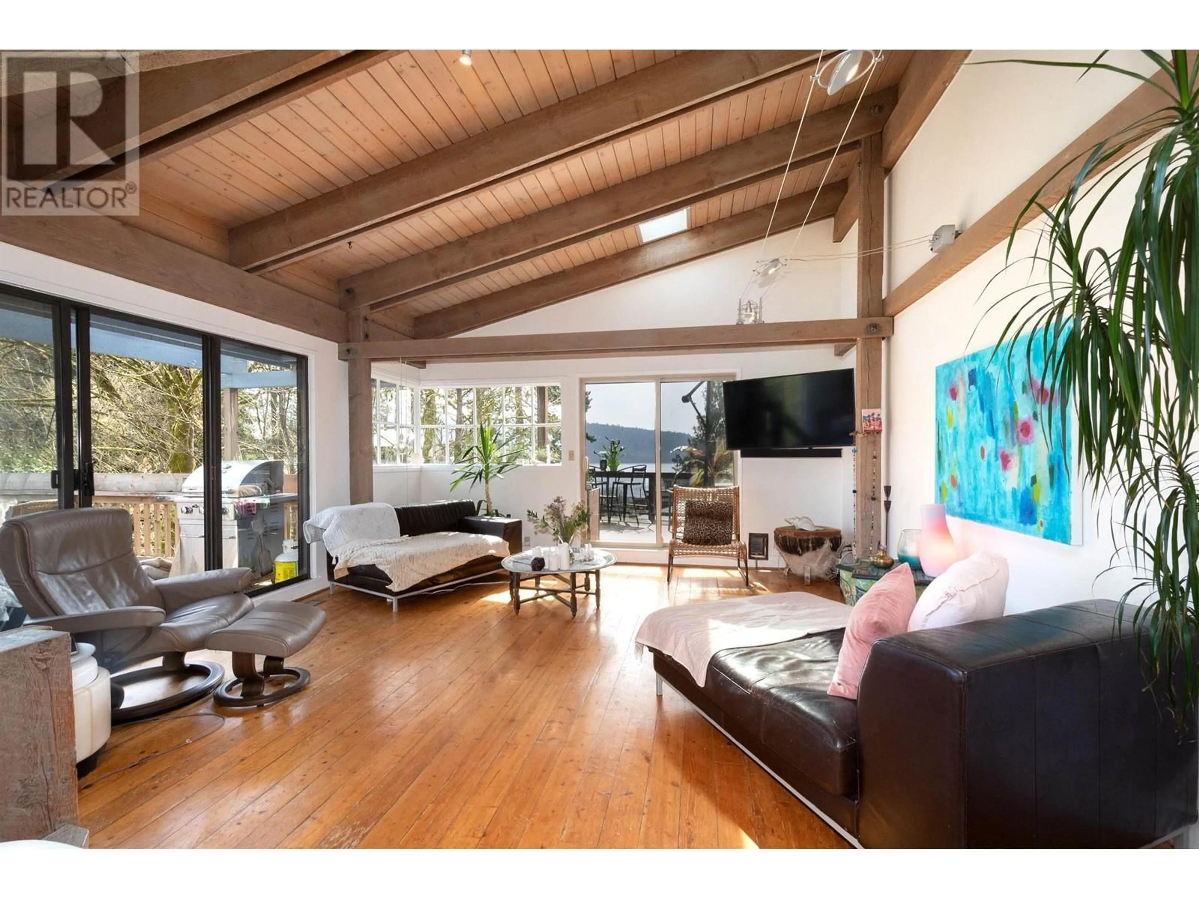 Living room with furniture, wood/laminate floor for 4477 STRATHCONA ROAD, North Vancouver British Columbia V7G1G7