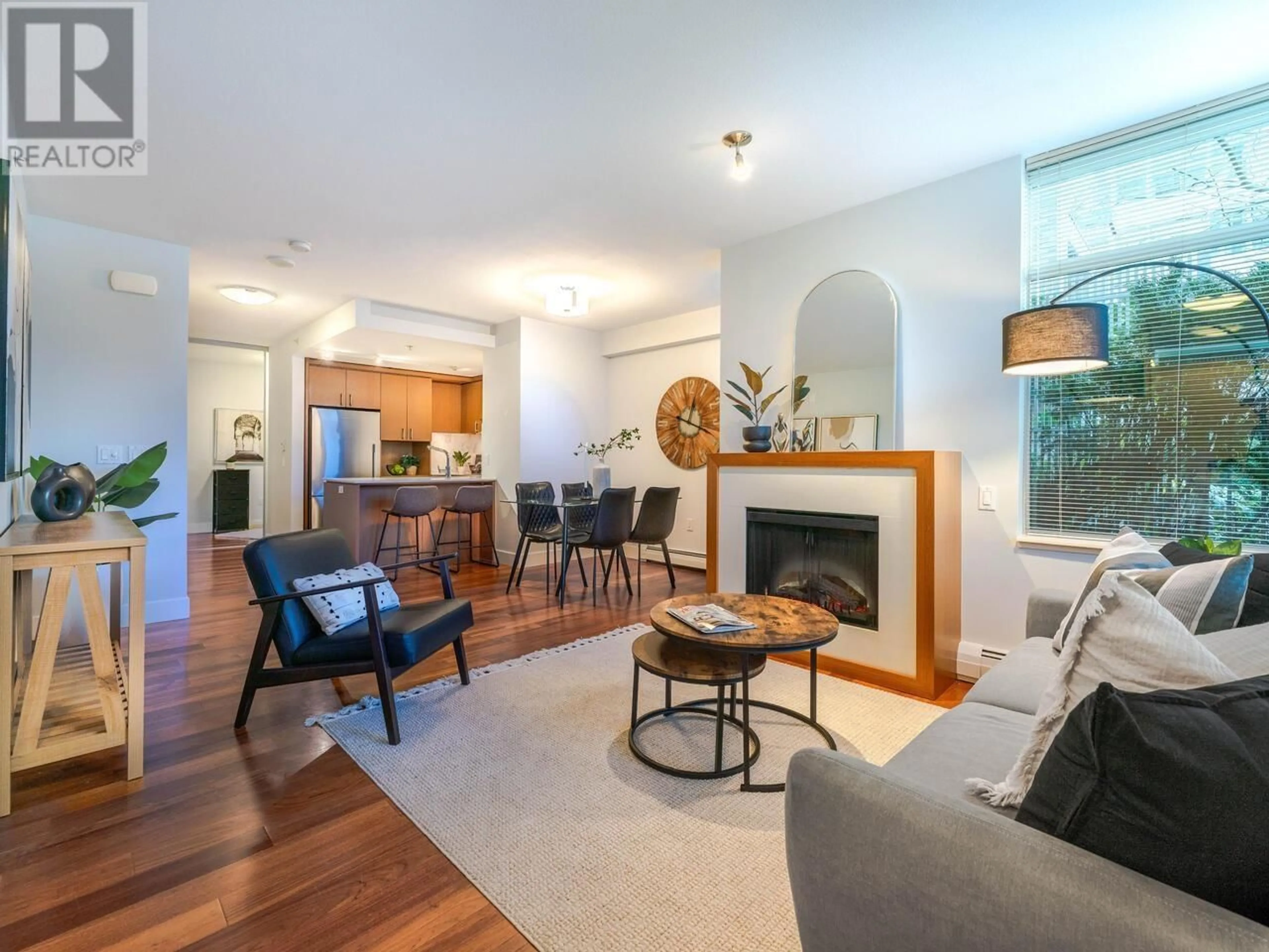 Living room with furniture, wood/laminate floor for 1303 CIVIC PLACE MEWS, North Vancouver British Columbia V7M0B2
