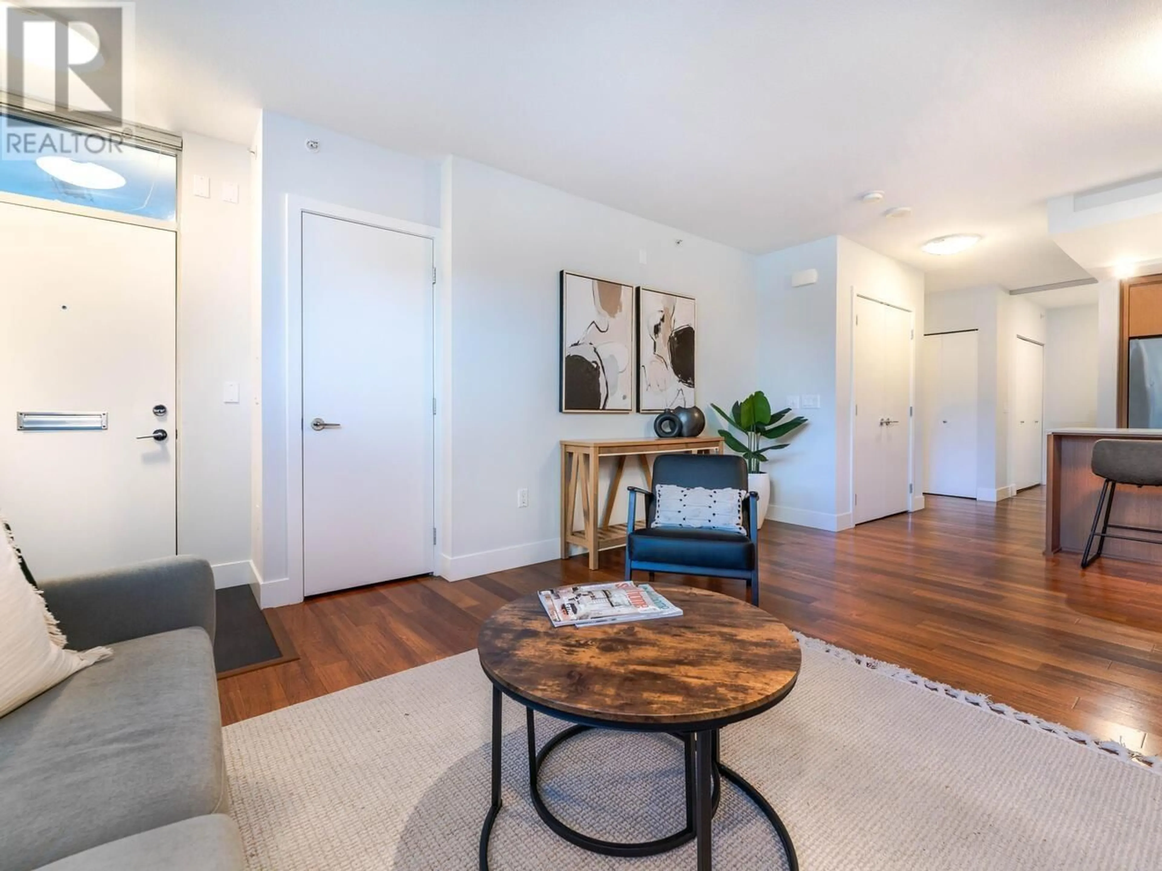 Living room with furniture, wood/laminate floor for 1303 CIVIC PLACE MEWS, North Vancouver British Columbia V7M0B2