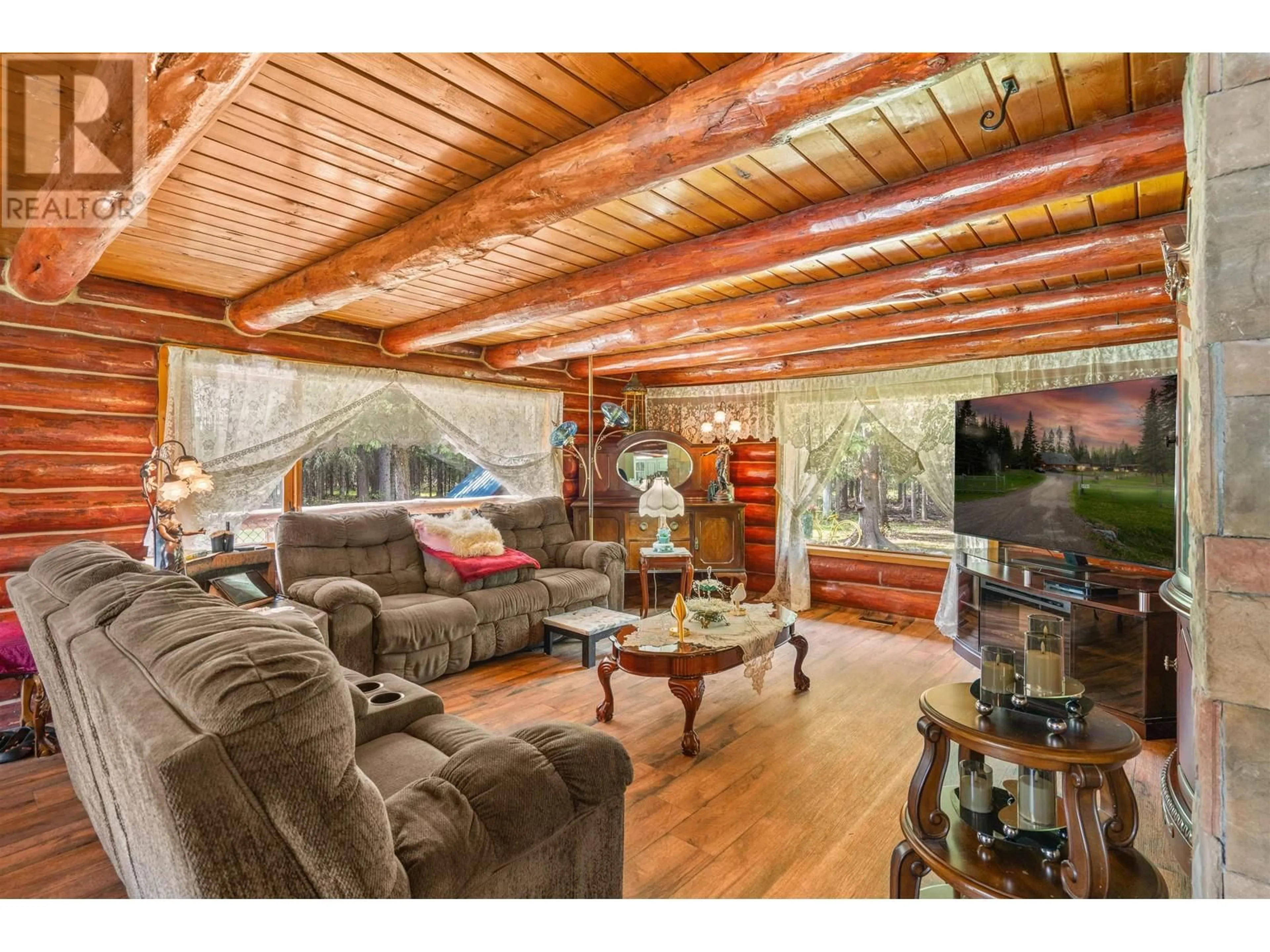 Living room with furniture, wood/laminate floor for 4751 PONDEROSA ROAD, Prince George British Columbia V2N6J6