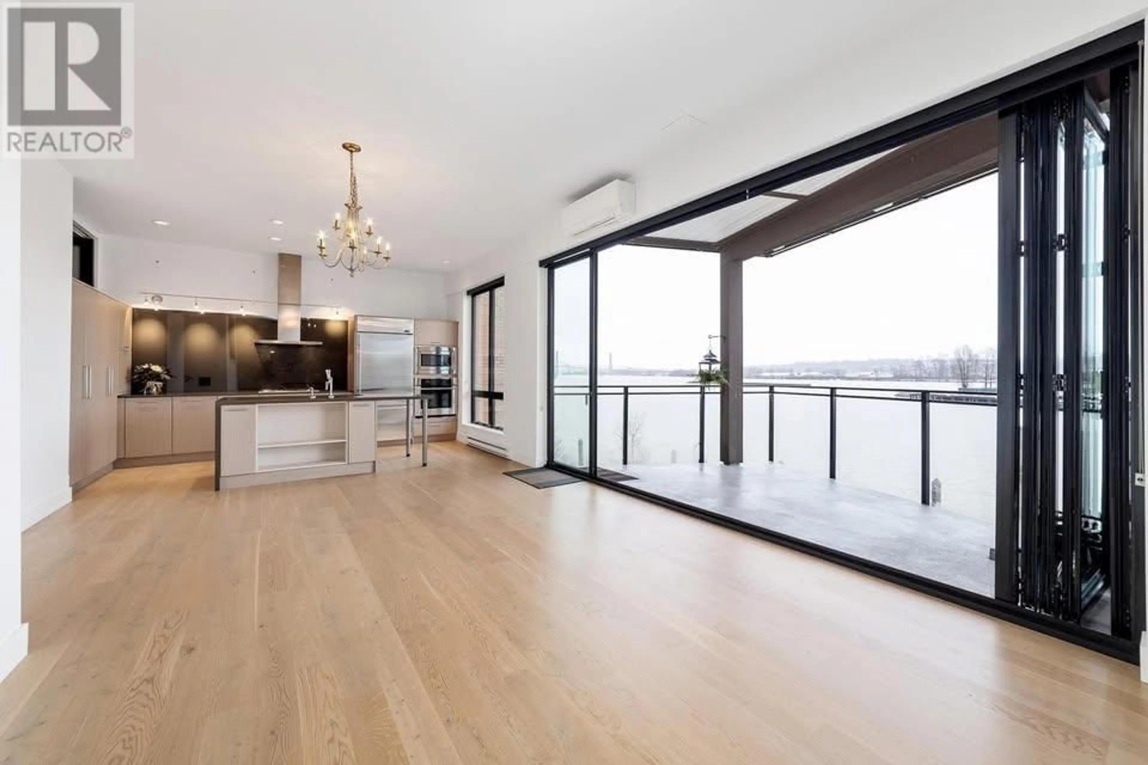 Open concept kitchen, wood/laminate floor for 313 - 220 SALTER STREET, New Westminster British Columbia V3M0H4