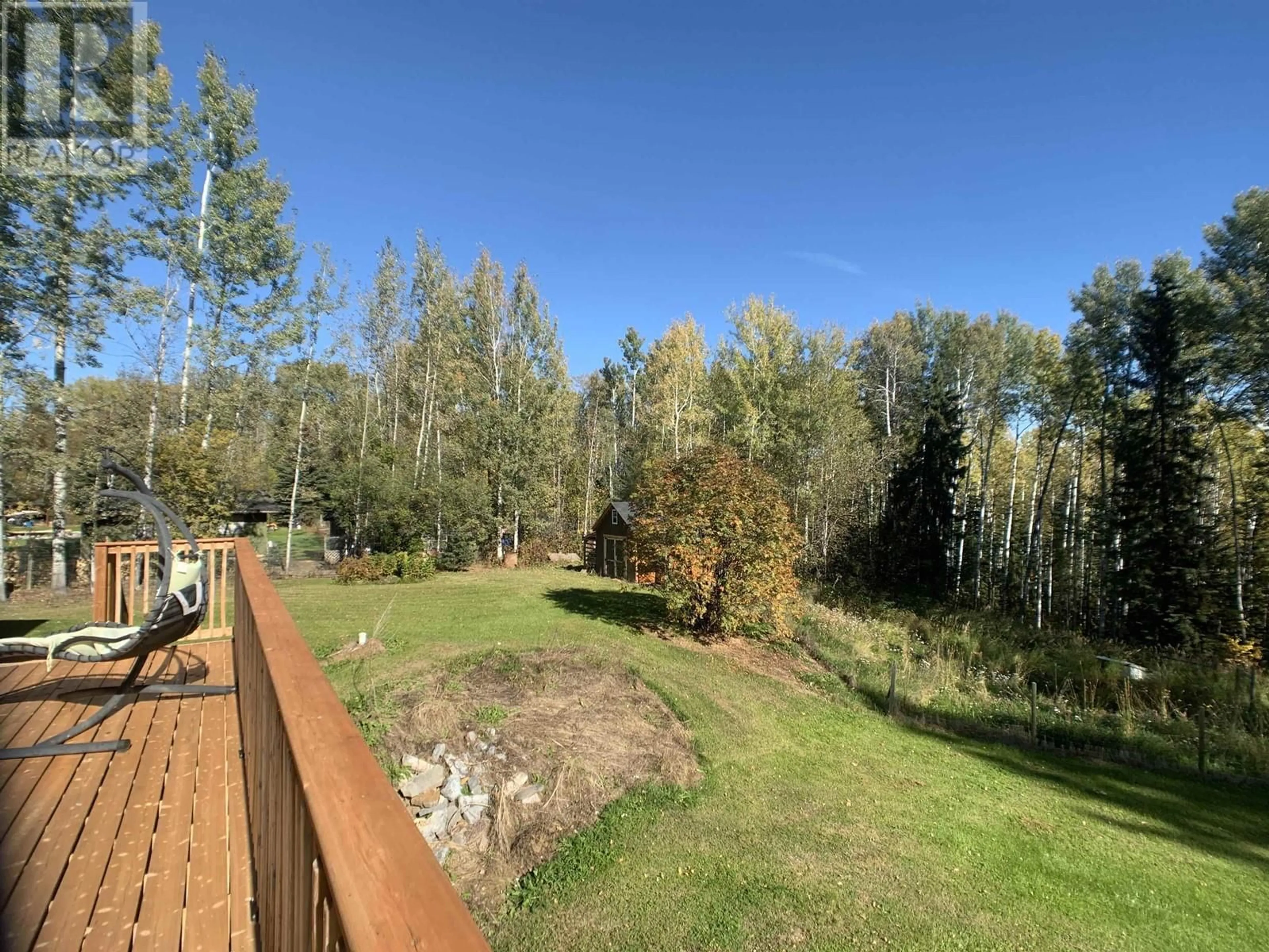 A pic from outside/outdoor area/front of a property/back of a property/a pic from drone, forest/trees view for 19 RAVEN CRESCENT, Fort Nelson British Columbia V0C1R0