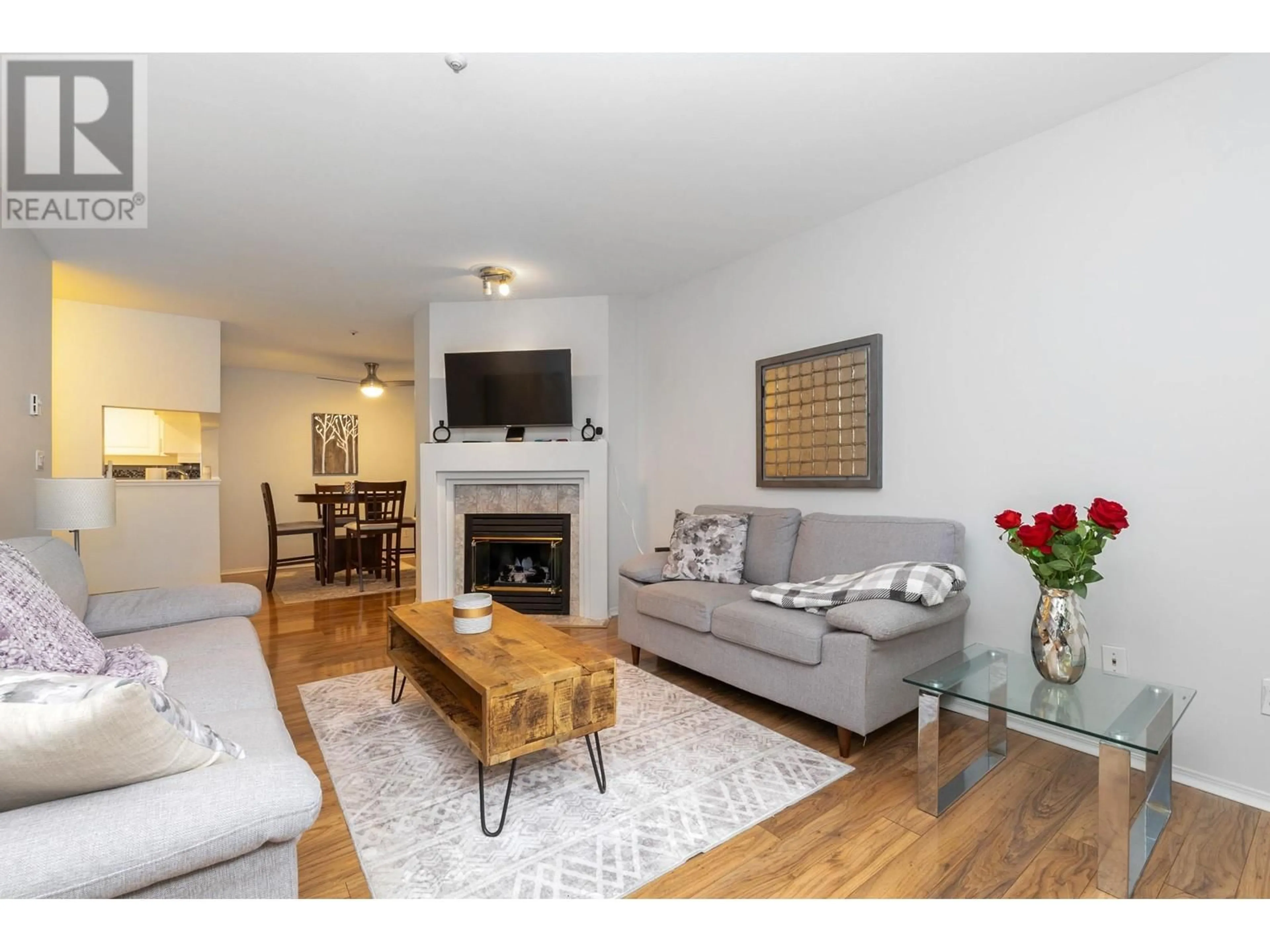 Living room with furniture, wood/laminate floor for 101 - 2231 WELCHER AVENUE, Port Coquitlam British Columbia V3C1X2