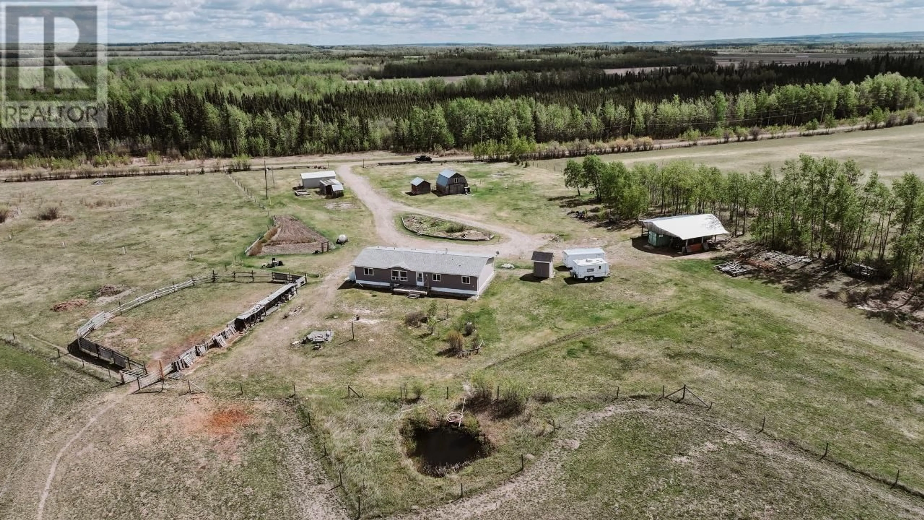 A pic from outside/outdoor area/front of a property/back of a property/a pic from drone, building for 13914 237 ROAD, Fort St. John British Columbia V1G0J2