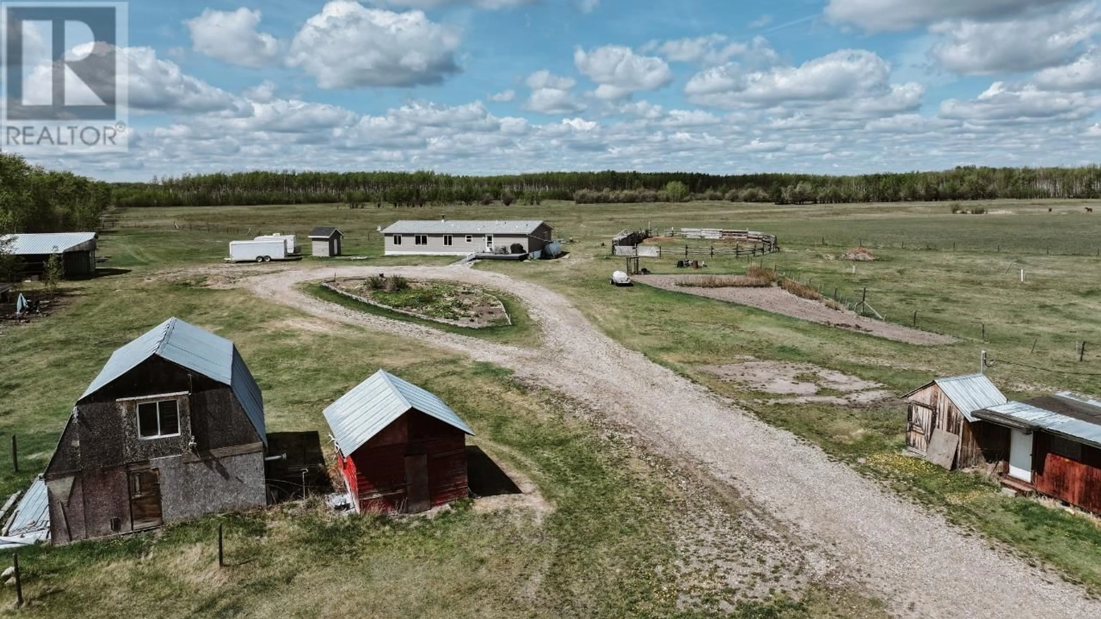 A pic from outside/outdoor area/front of a property/back of a property/a pic from drone, building for 13914 237 ROAD, Fort St. John British Columbia V1G0J2