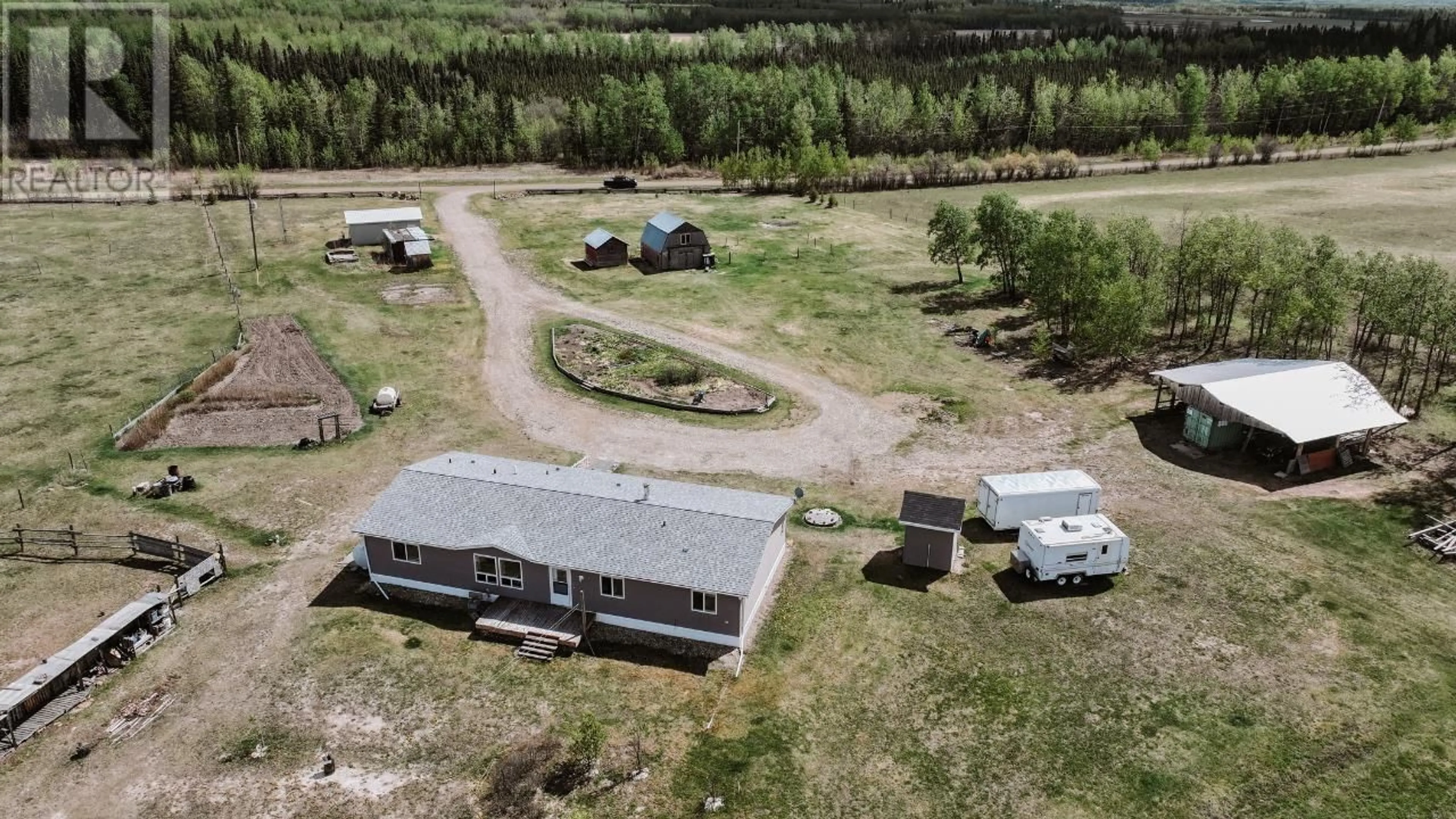 A pic from outside/outdoor area/front of a property/back of a property/a pic from drone, building for 13914 237 ROAD, Fort St. John British Columbia V1G0J2