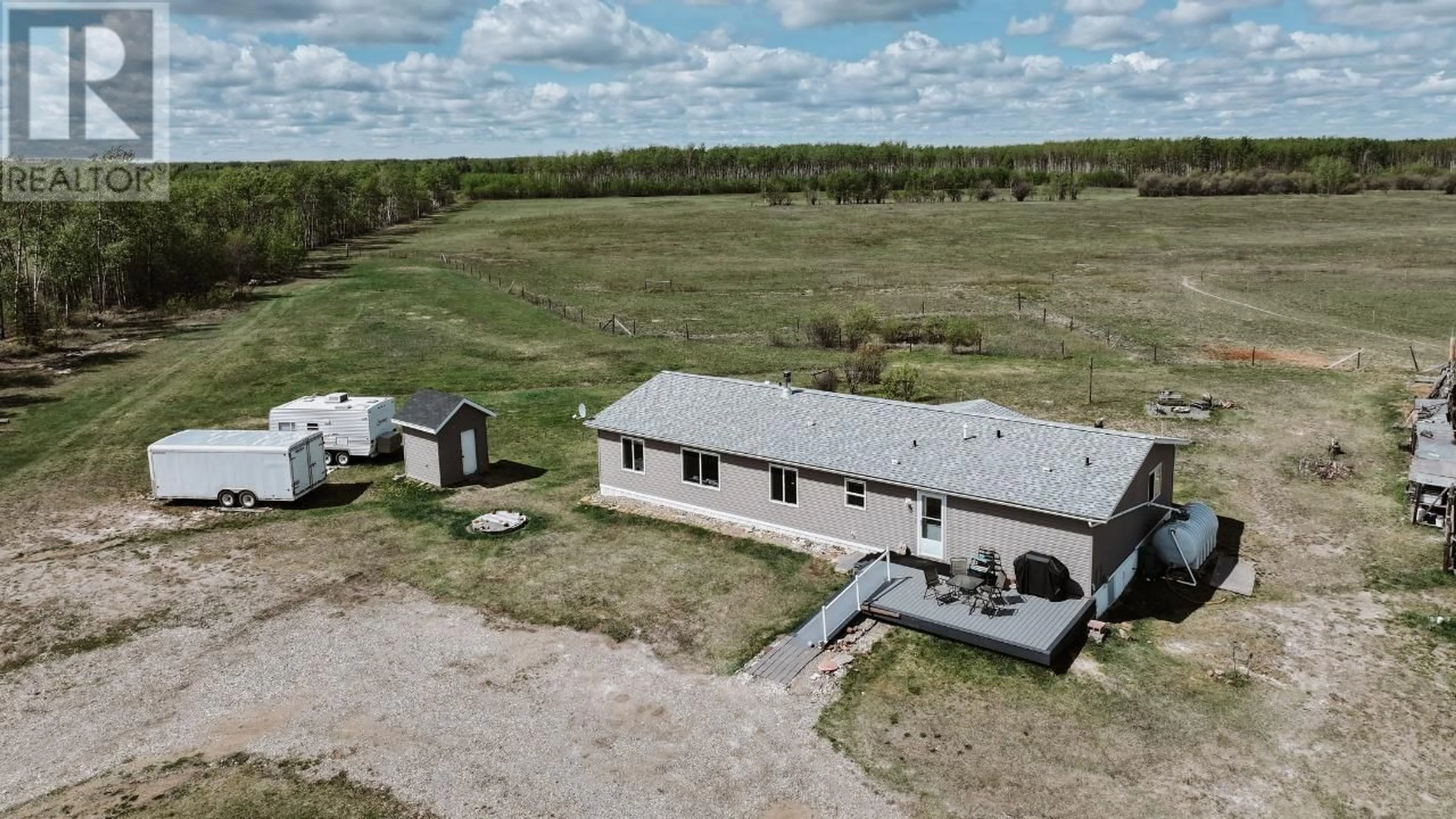 A pic from outside/outdoor area/front of a property/back of a property/a pic from drone, building for 13914 237 ROAD, Fort St. John British Columbia V1G0J2