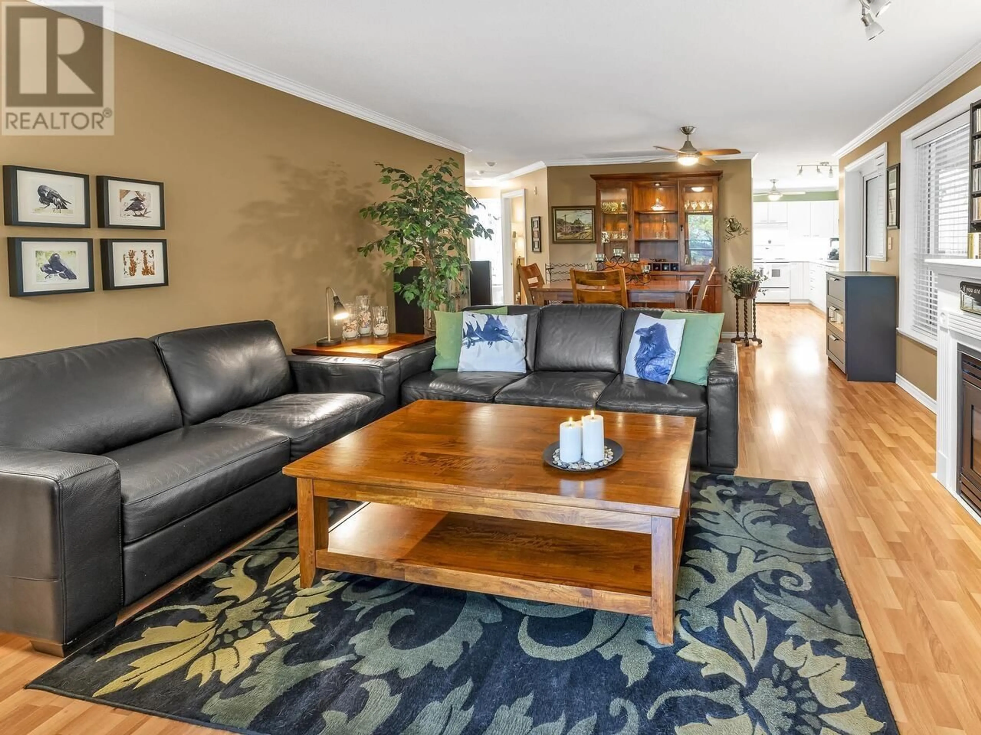 Living room with furniture, wood/laminate floor for 207 - 12 LAGUNA COURT, New Westminster British Columbia V3M6W4