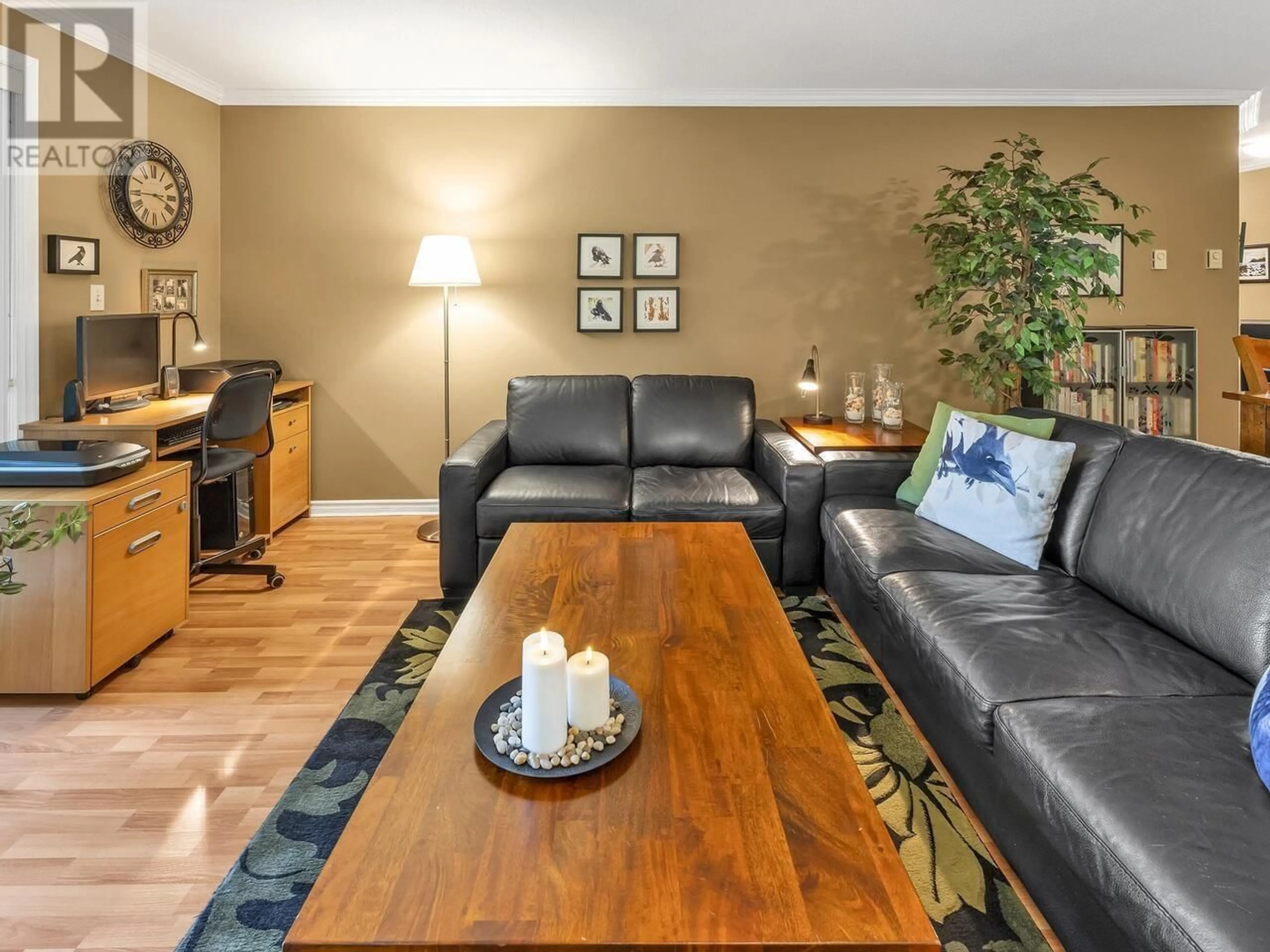 Living room with furniture, wood/laminate floor for 207 - 12 LAGUNA COURT, New Westminster British Columbia V3M6W4