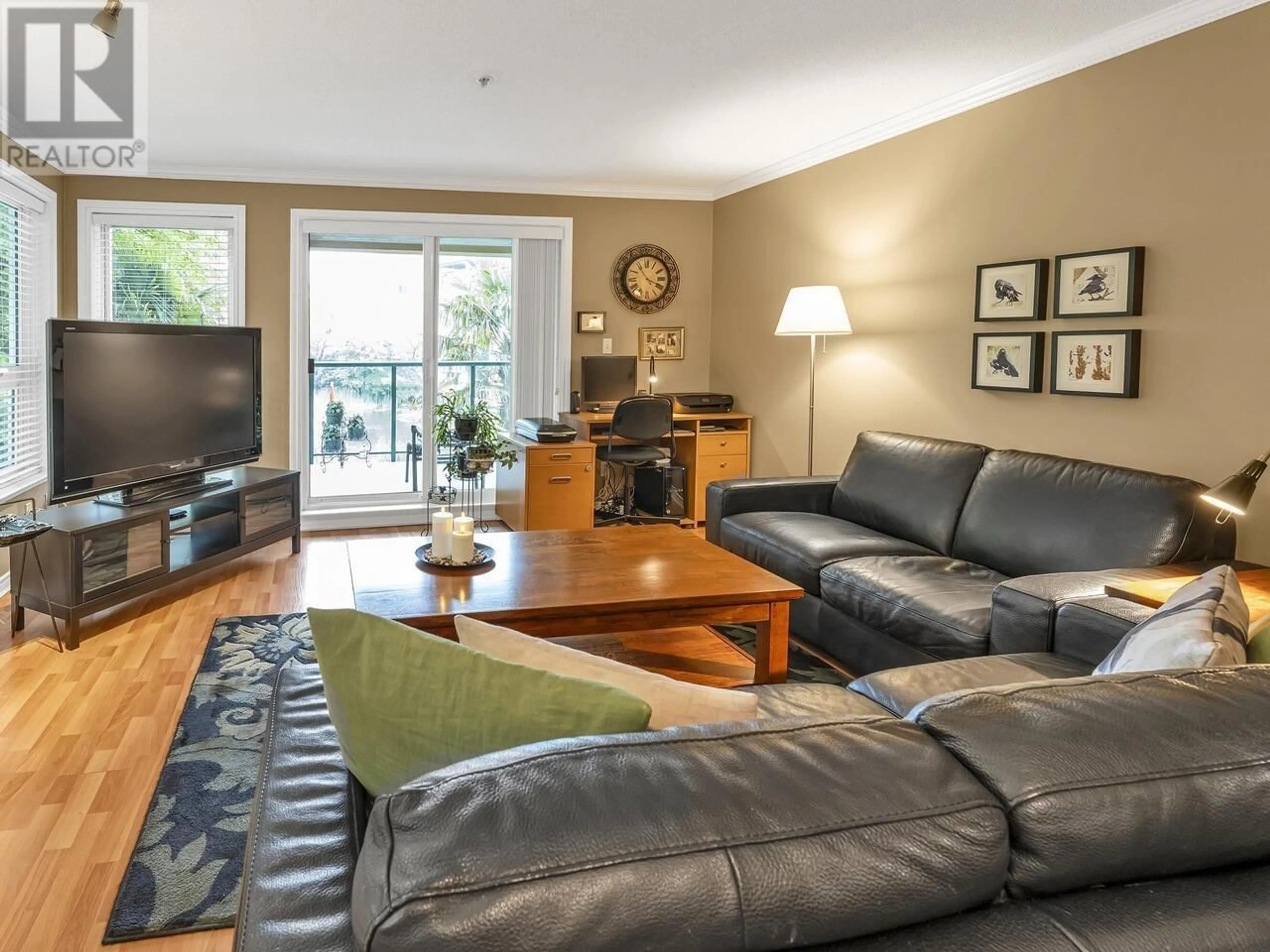 Living room with furniture, wood/laminate floor for 207 - 12 LAGUNA COURT, New Westminster British Columbia V3M6W4