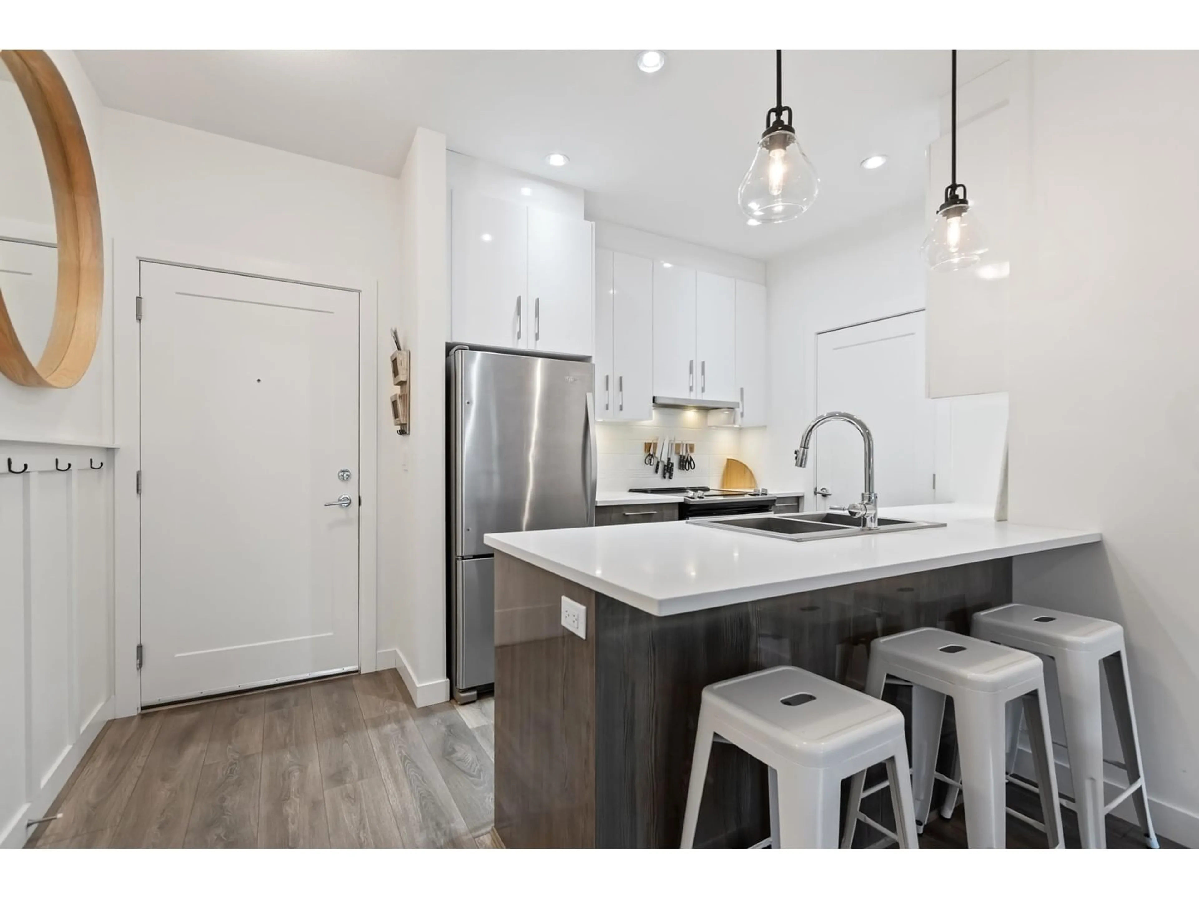 Open concept kitchen, wood/laminate floor for 117 - 20829 77A, Langley British Columbia V2Y0Y5