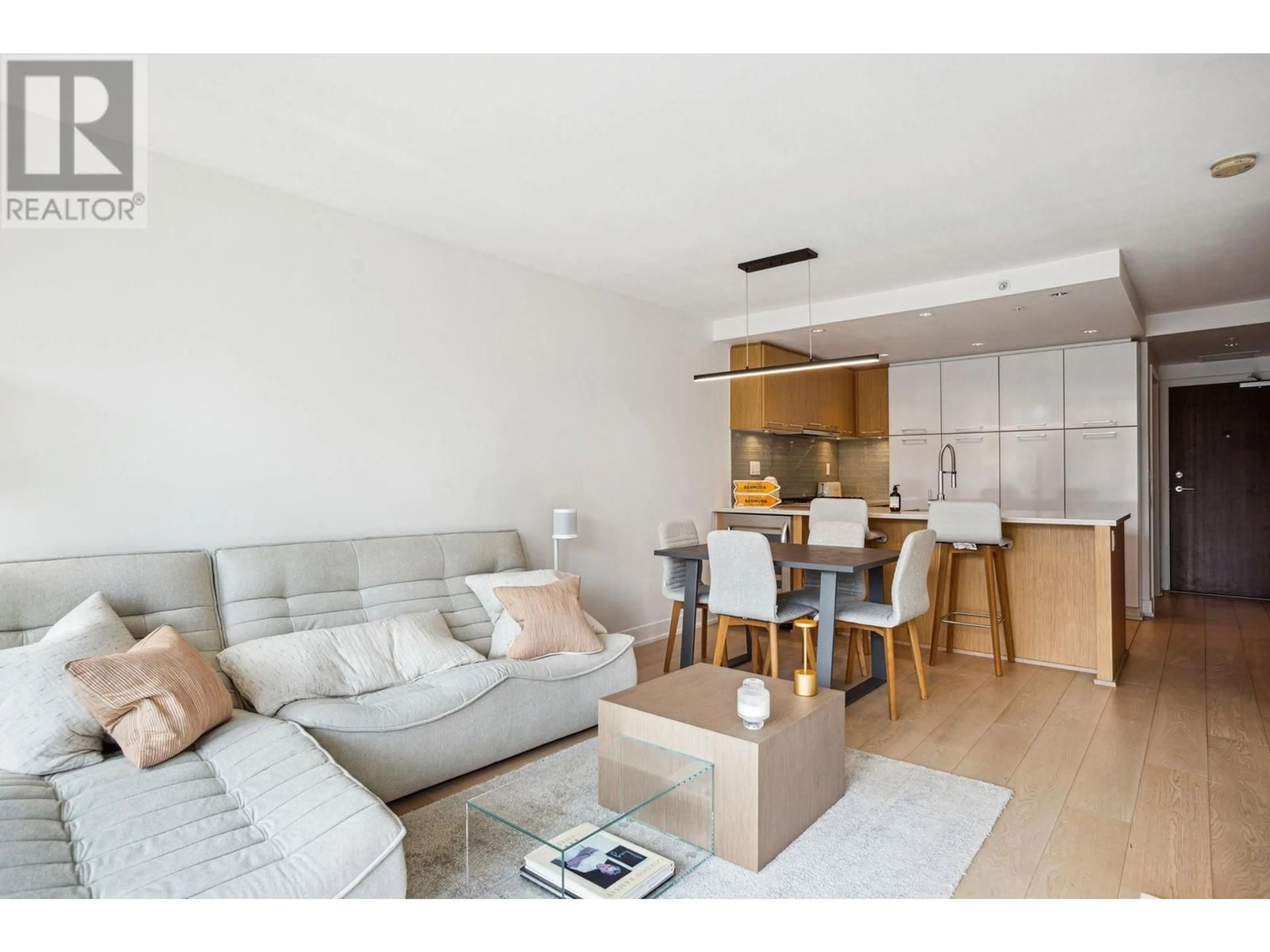 Living room with furniture, wood/laminate floor for 303 - 1680 WEST 4TH AVENUE, Vancouver British Columbia V6J0B7