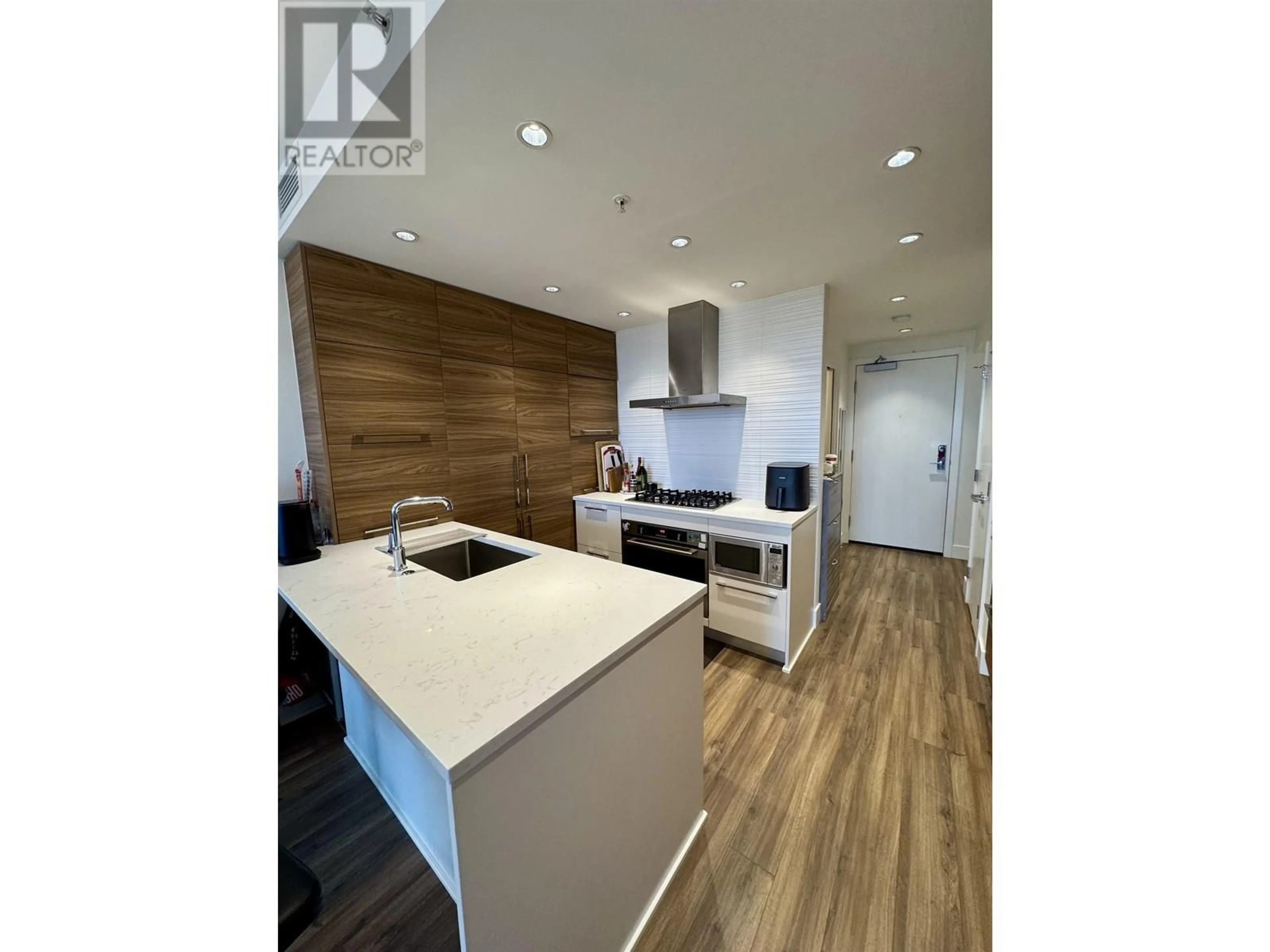 Open concept kitchen, wood/laminate floor for 706 - 7303 NOBLE LANE, Burnaby British Columbia V3N0H2
