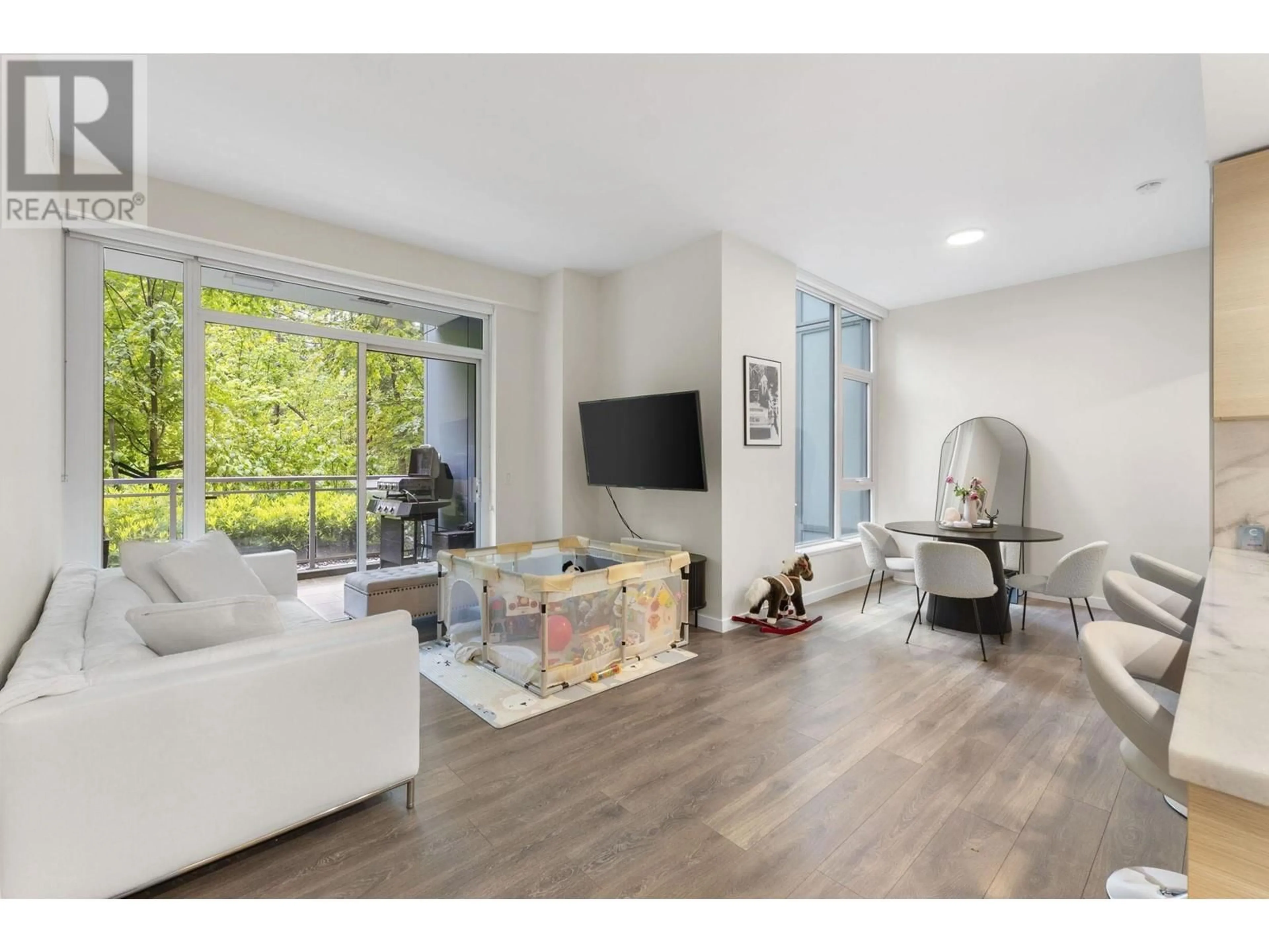 Living room with furniture, unknown for 104 - 305 MORRISSEY ROAD, Port Moody British Columbia V3H0M3