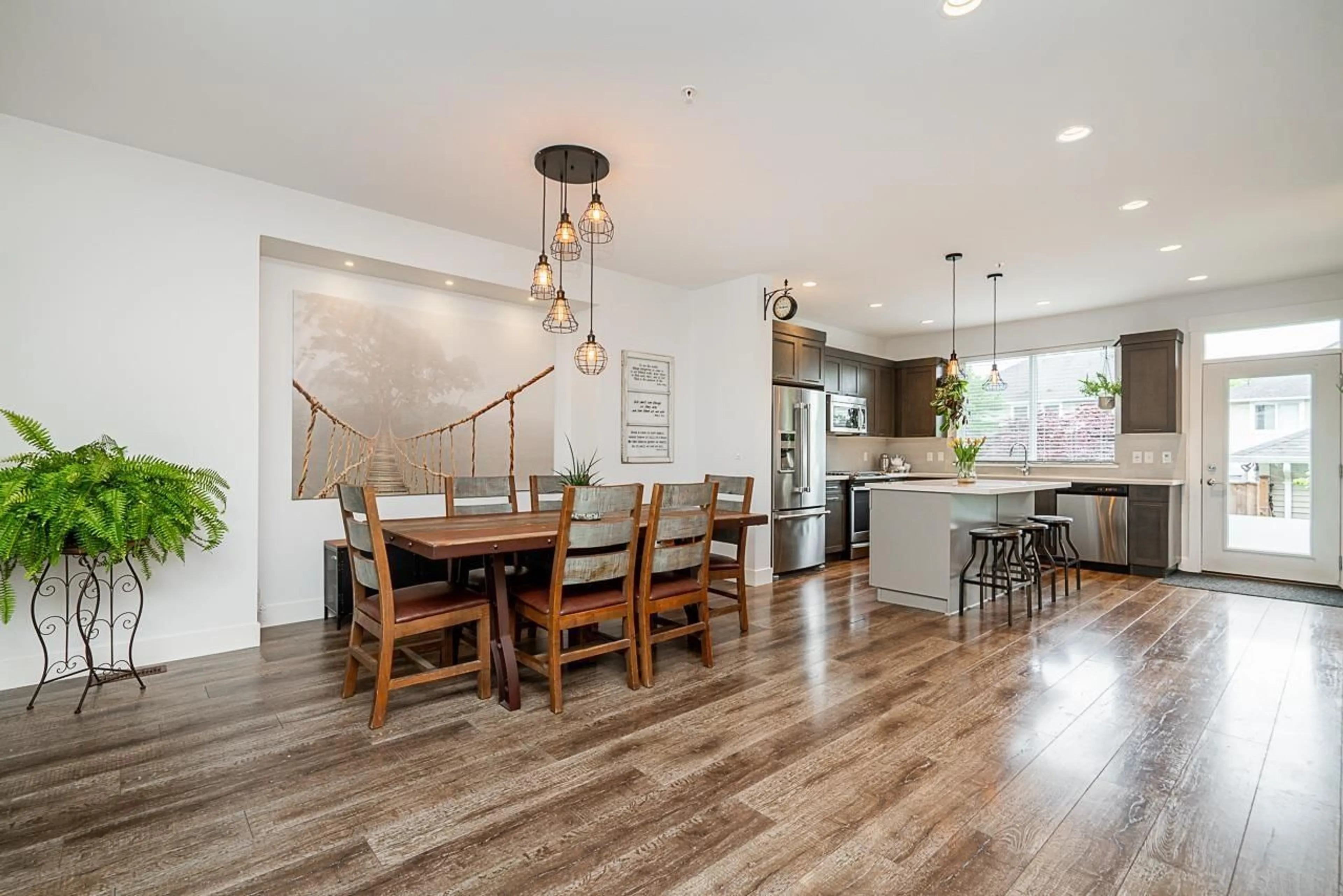 Open concept kitchen, wood/laminate floor for 8437 207A, Langley British Columbia V2Y0S4