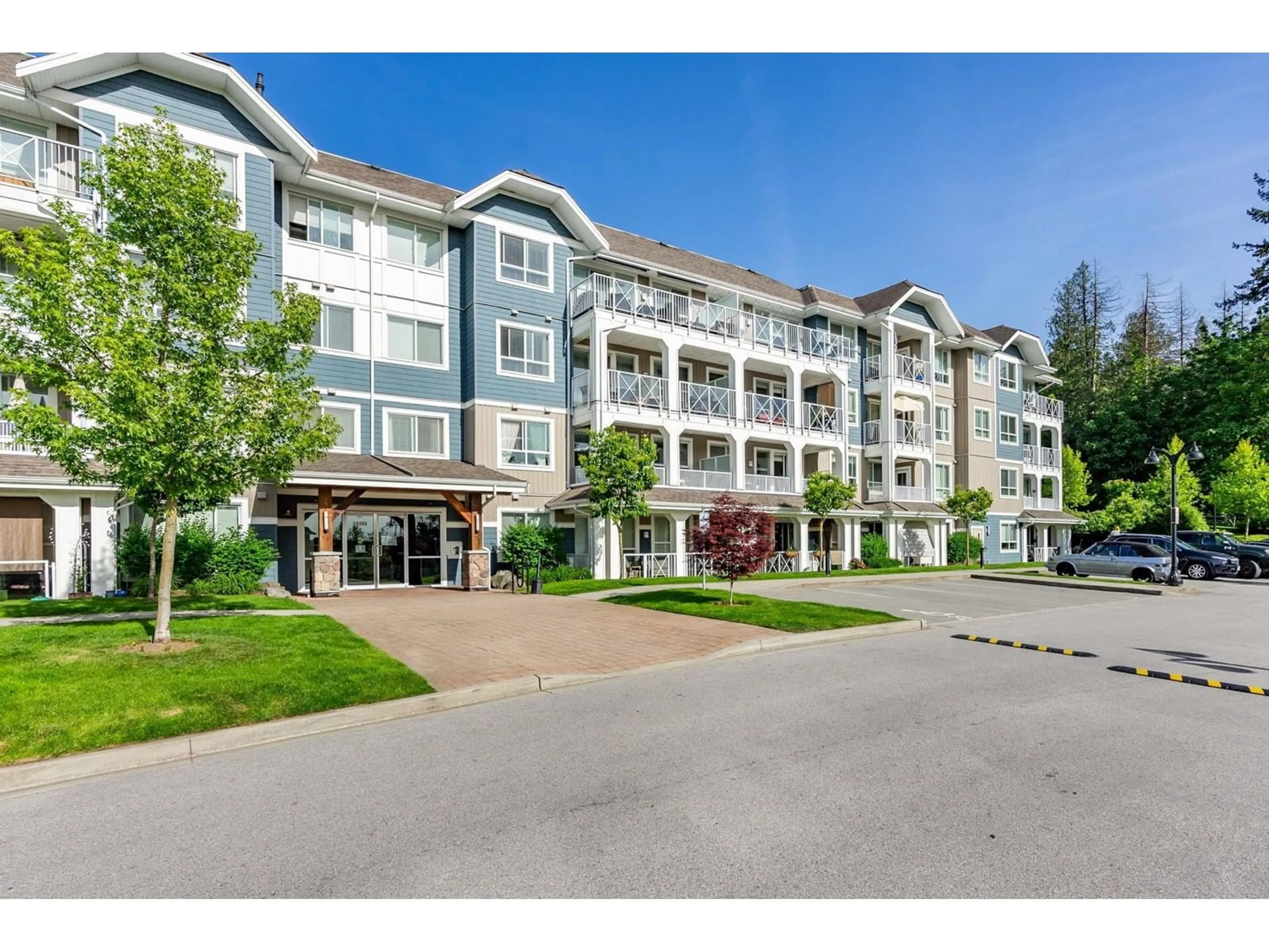 A pic from outside/outdoor area/front of a property/back of a property/a pic from drone, mountain view for 209 - 16396 64, Surrey British Columbia V3S6X6