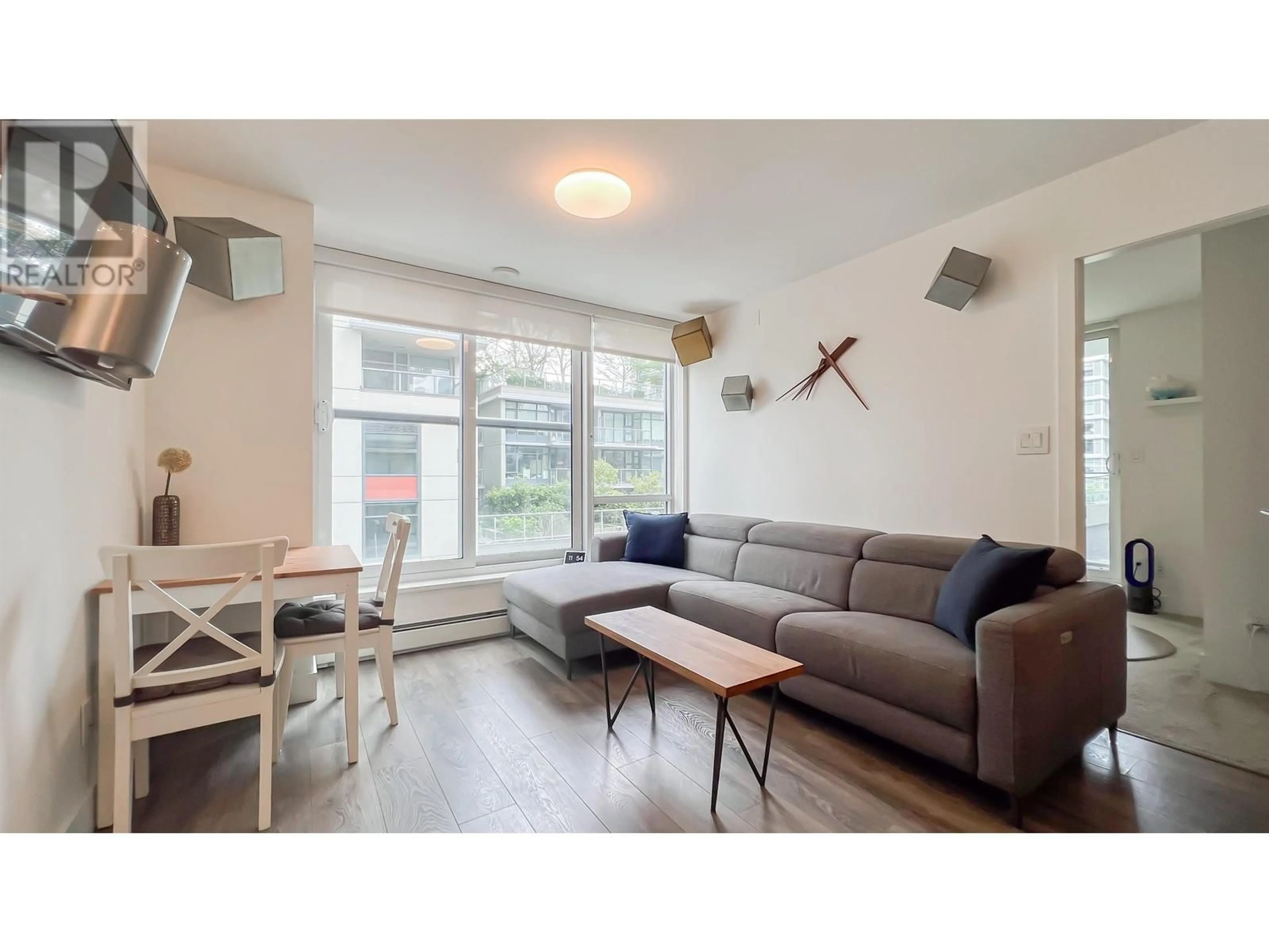 Living room with furniture, wood/laminate floor for 503 - 1788 COLUMBIA STREET, Vancouver British Columbia V5Y0L7