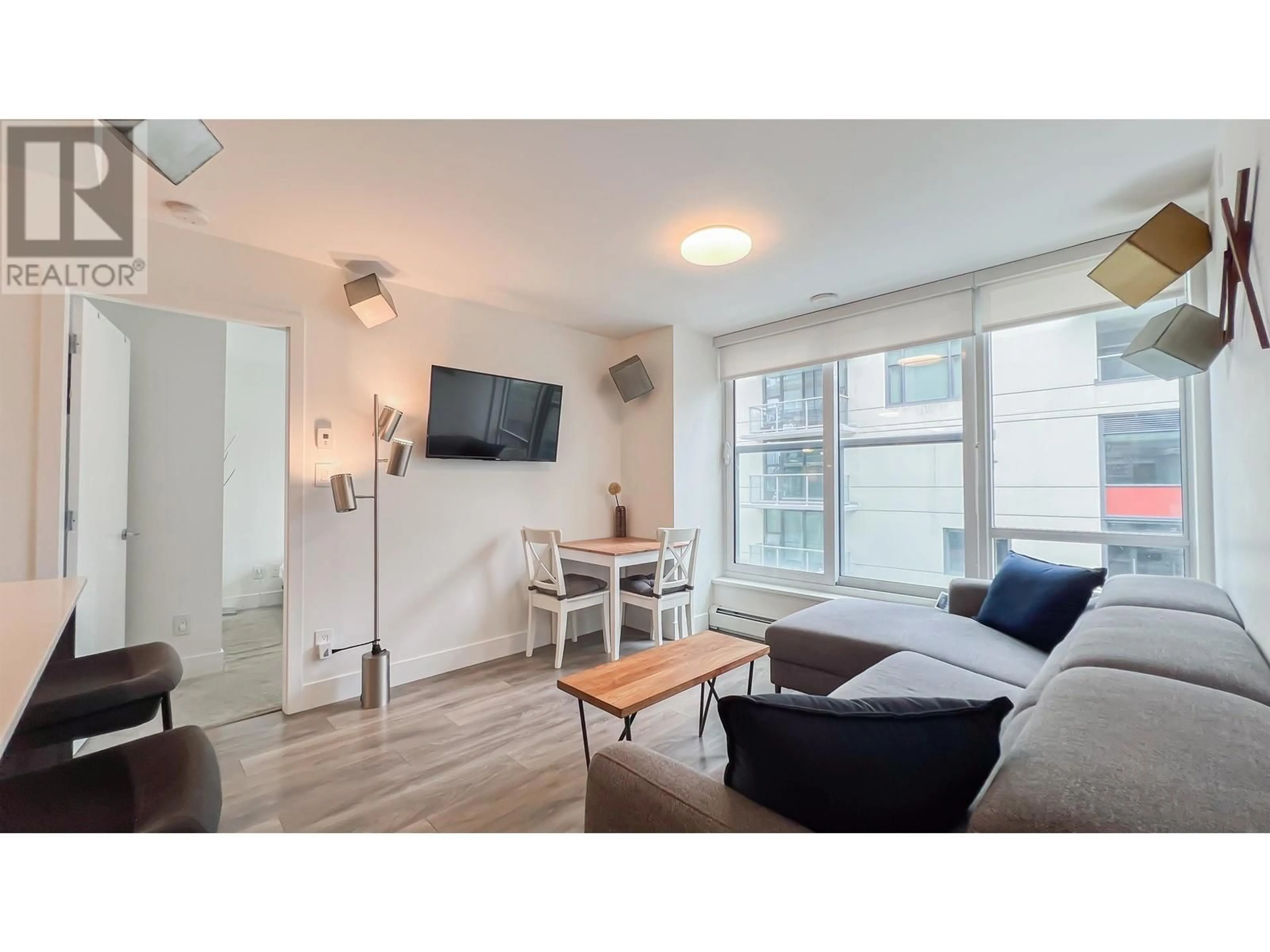 Living room with furniture, wood/laminate floor for 503 - 1788 COLUMBIA STREET, Vancouver British Columbia V5Y0L7