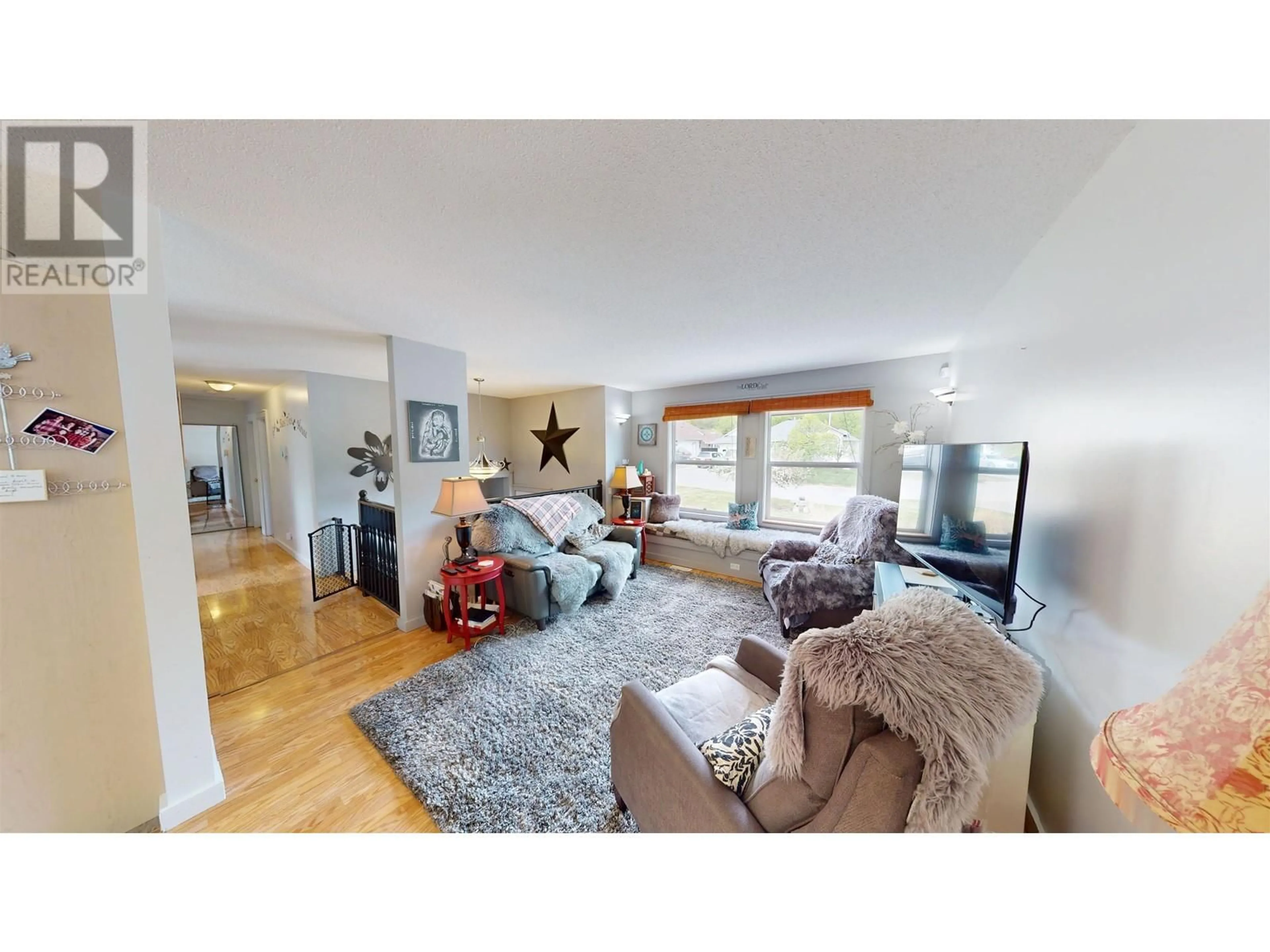 Living room with furniture, wood/laminate floor for 1580 DODDS AVENUE, Quesnel British Columbia V2J6B8