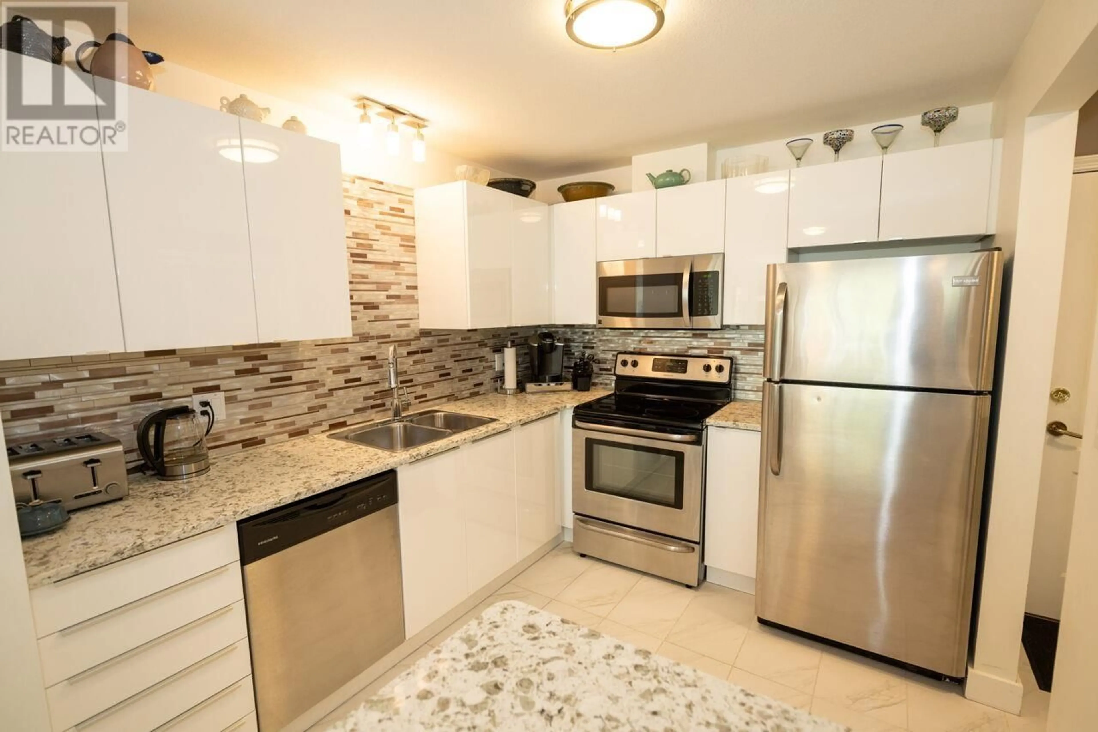 Standard kitchen, ceramic/tile floor for 202 - 2551 PARKVIEW LANE, Port Coquitlam British Columbia V3C6J8