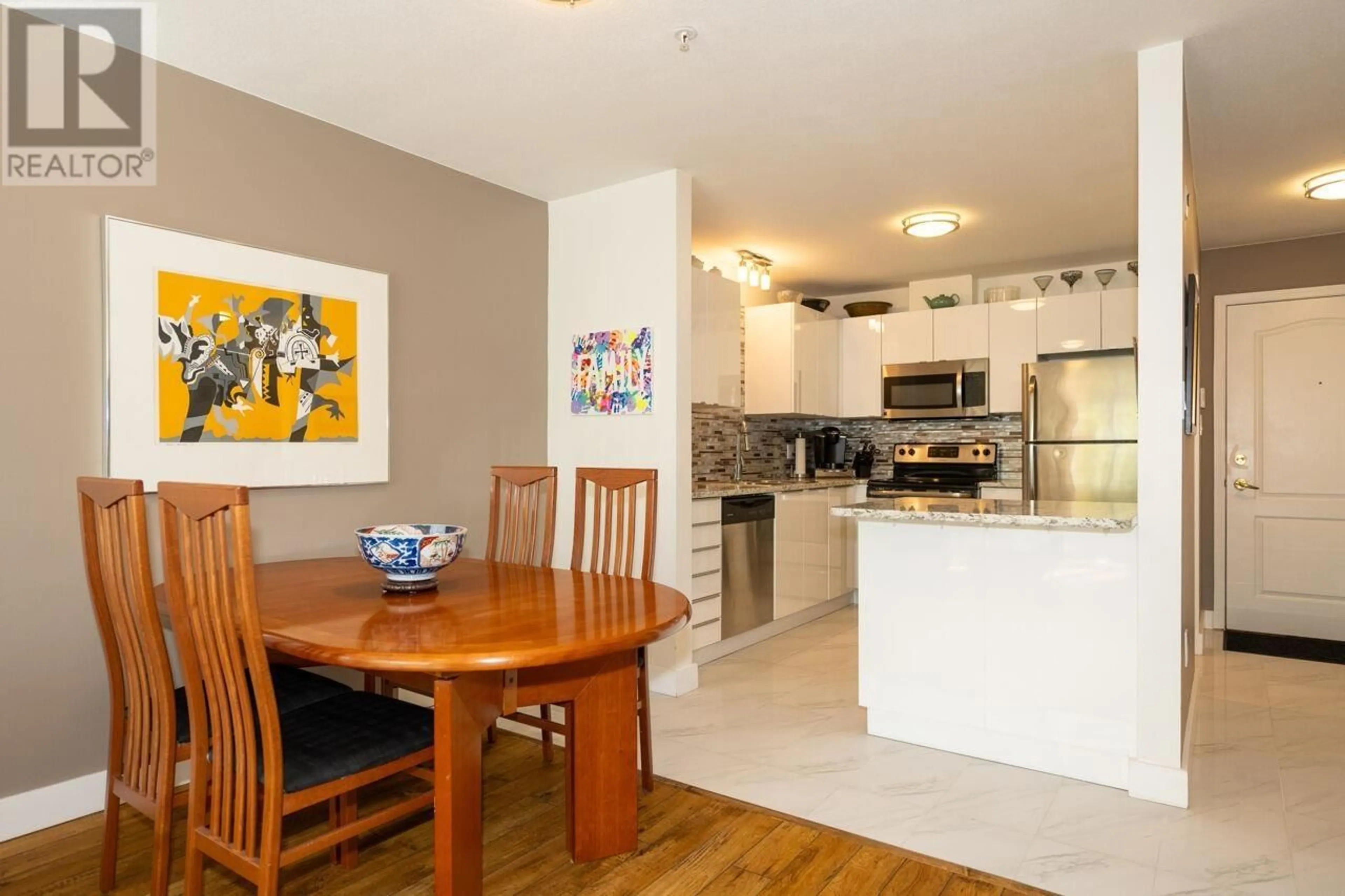 Open concept kitchen, wood/laminate floor for 202 - 2551 PARKVIEW LANE, Port Coquitlam British Columbia V3C6J8