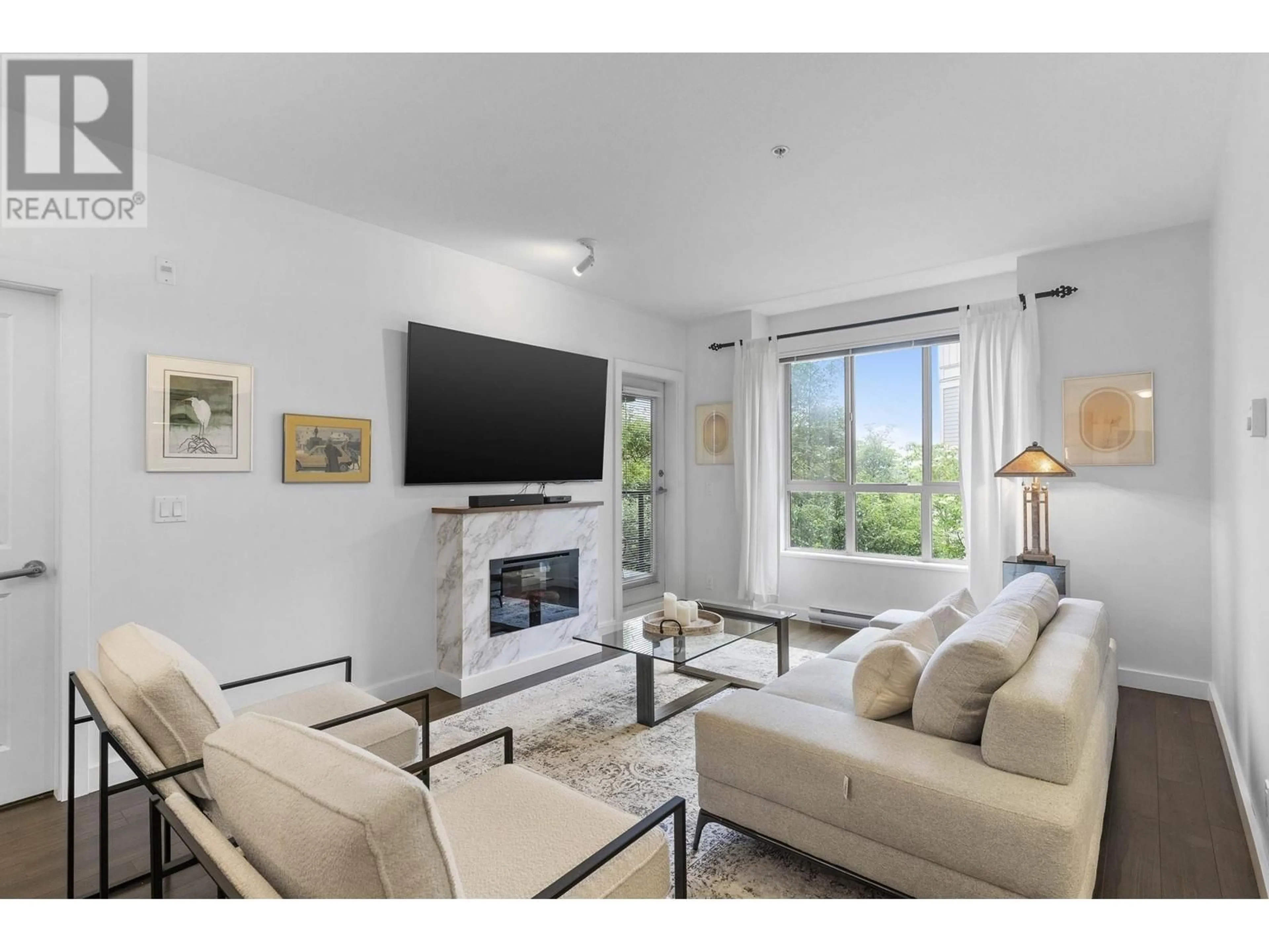 Living room with furniture, unknown for 202 - 250 FRANCIS WAY, New Westminster British Columbia V3L0E6