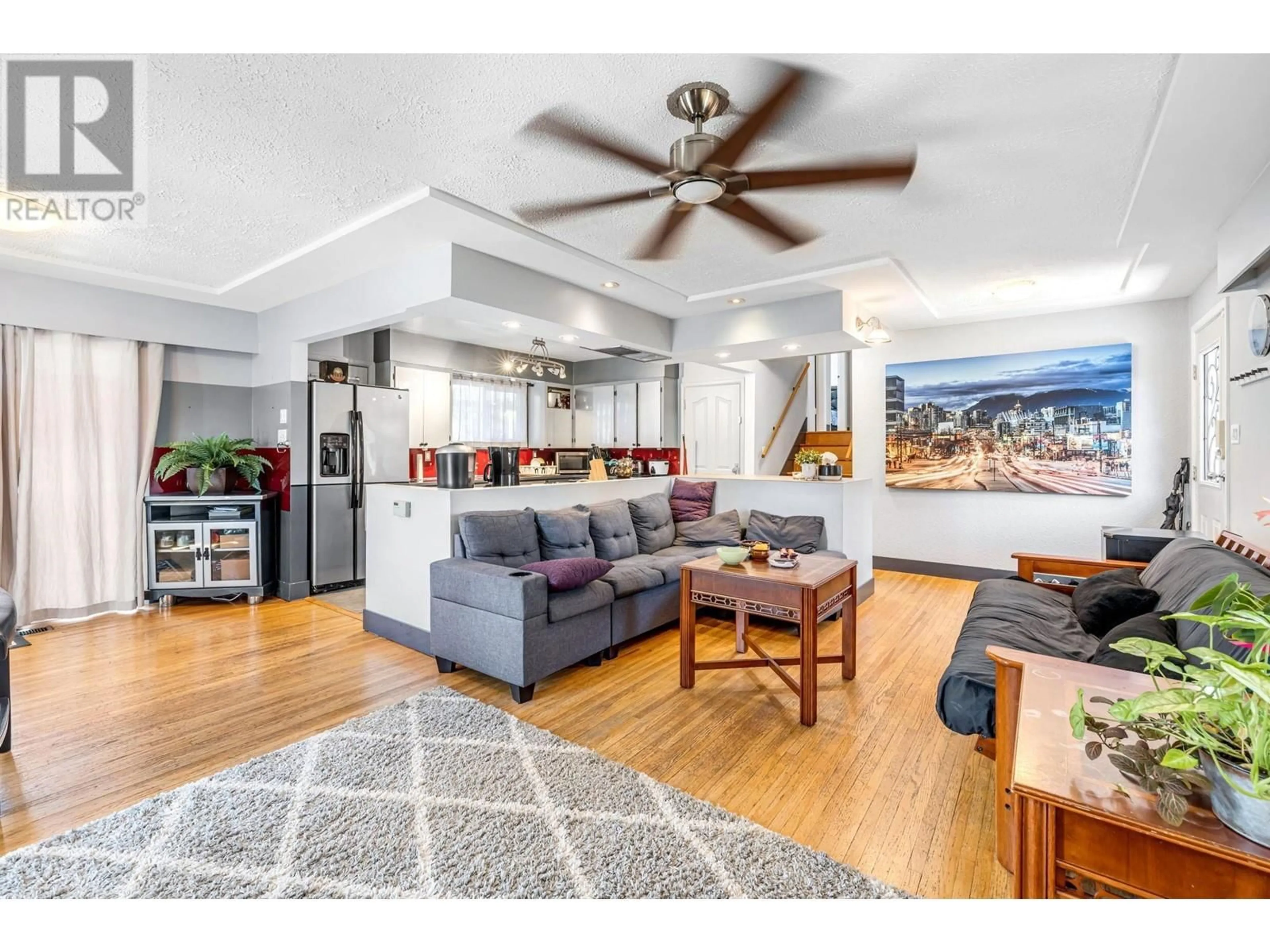 Living room with furniture, wood/laminate floor for 2715 COAST MERIDIAN ROAD, Port Coquitlam British Columbia V3B3M6