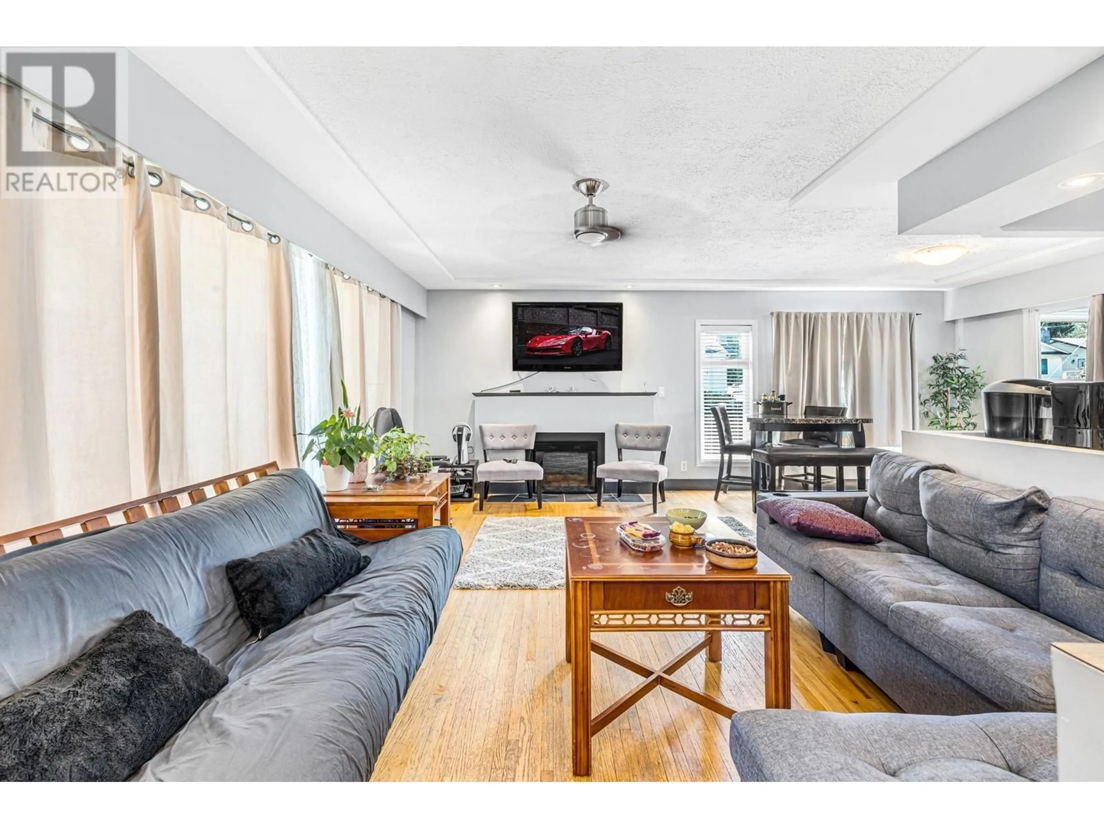 Living room with furniture, wood/laminate floor for 2715 COAST MERIDIAN ROAD, Port Coquitlam British Columbia V3B3M6