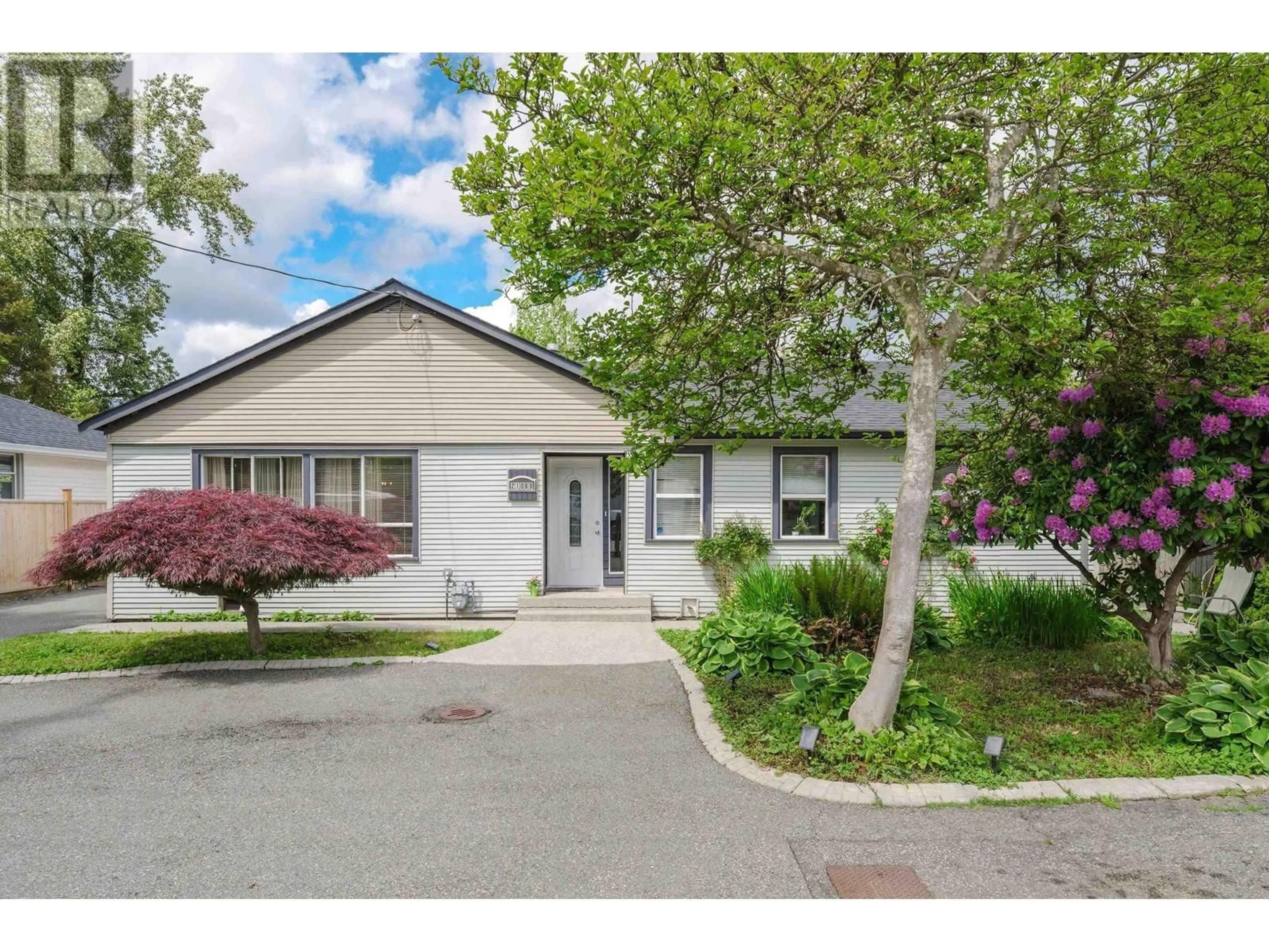 Home with vinyl exterior material, street for 21089 DEWDNEY TRUNK ROAD, Maple Ridge British Columbia V2X3G1