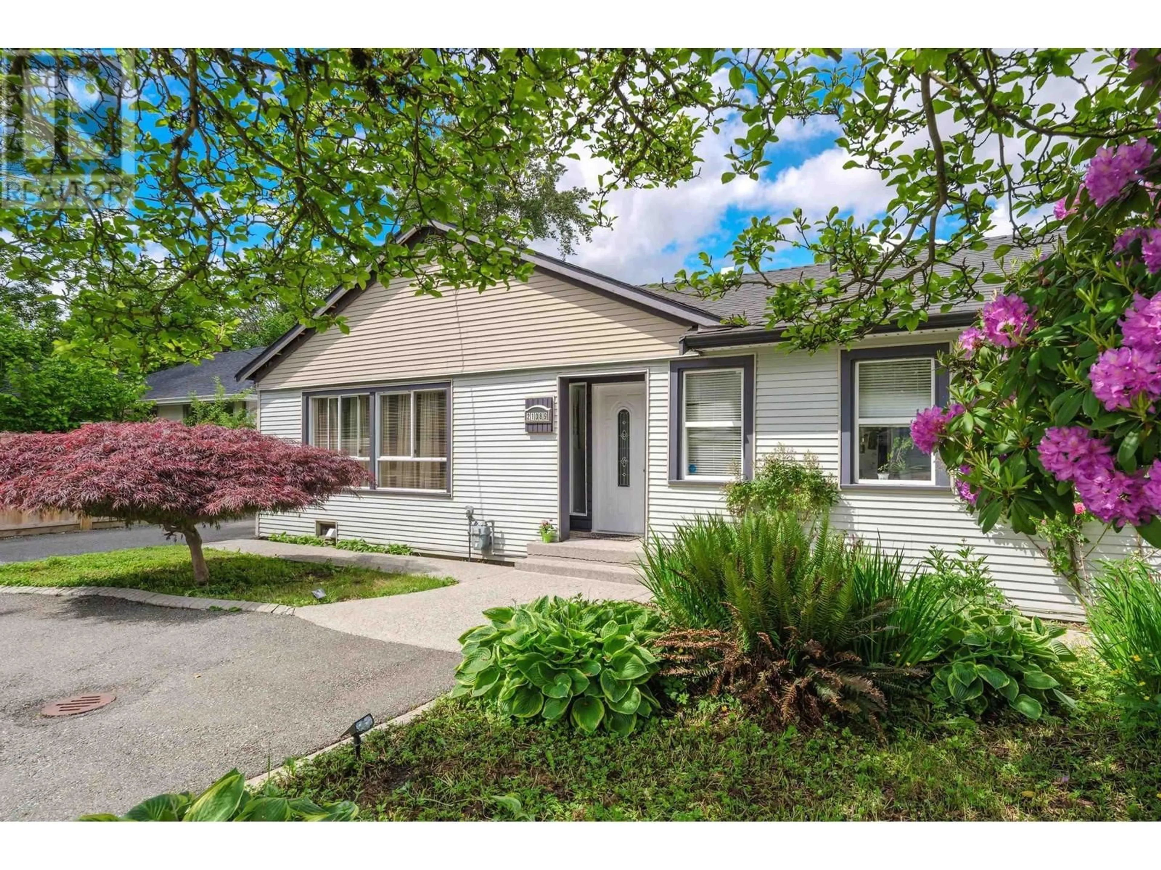 Home with vinyl exterior material, street for 21089 DEWDNEY TRUNK ROAD, Maple Ridge British Columbia V2X3G1