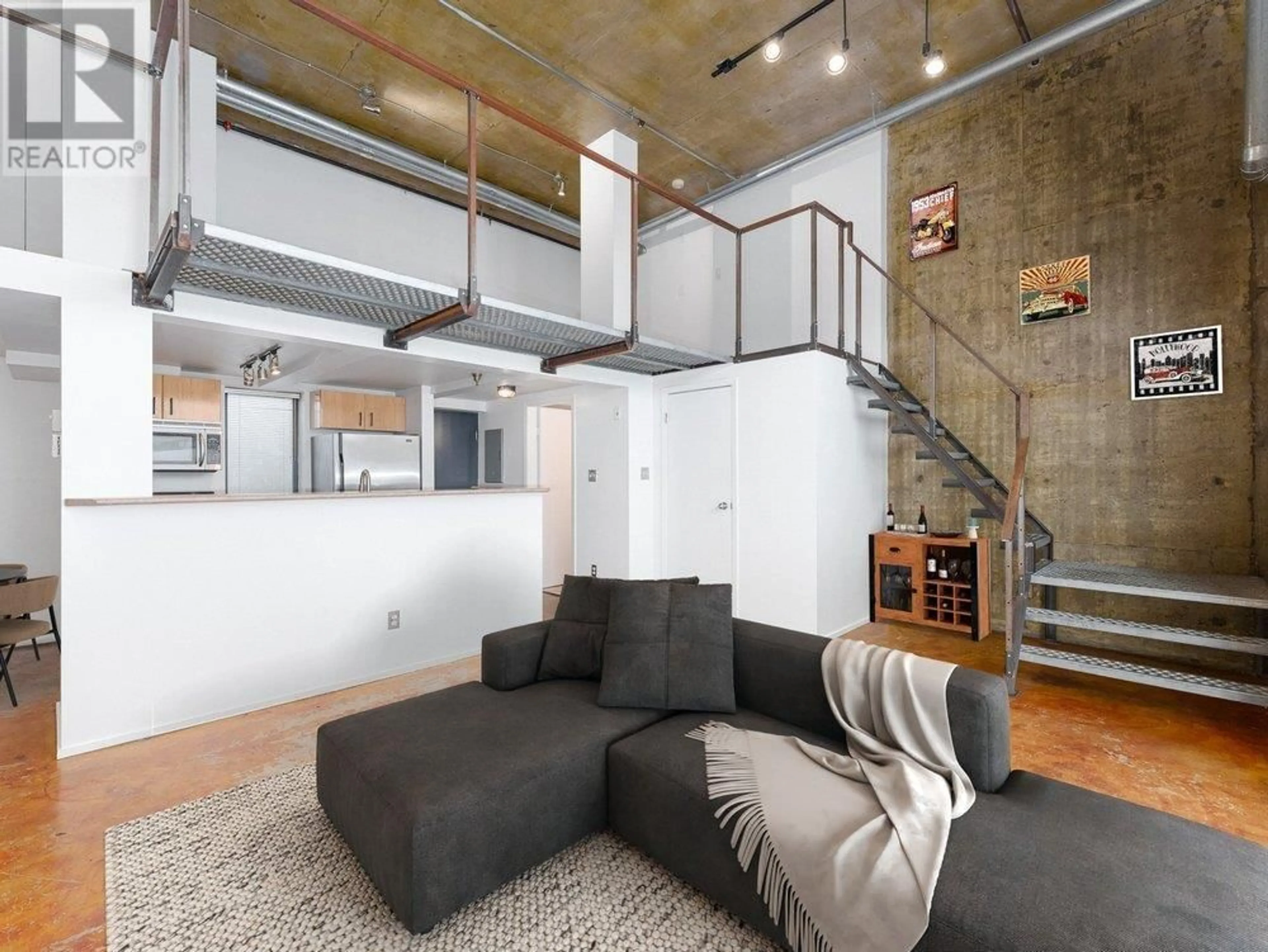 Living room with furniture, cement floor for 419 - 2001 WALL STREET, Vancouver British Columbia V5L5E4