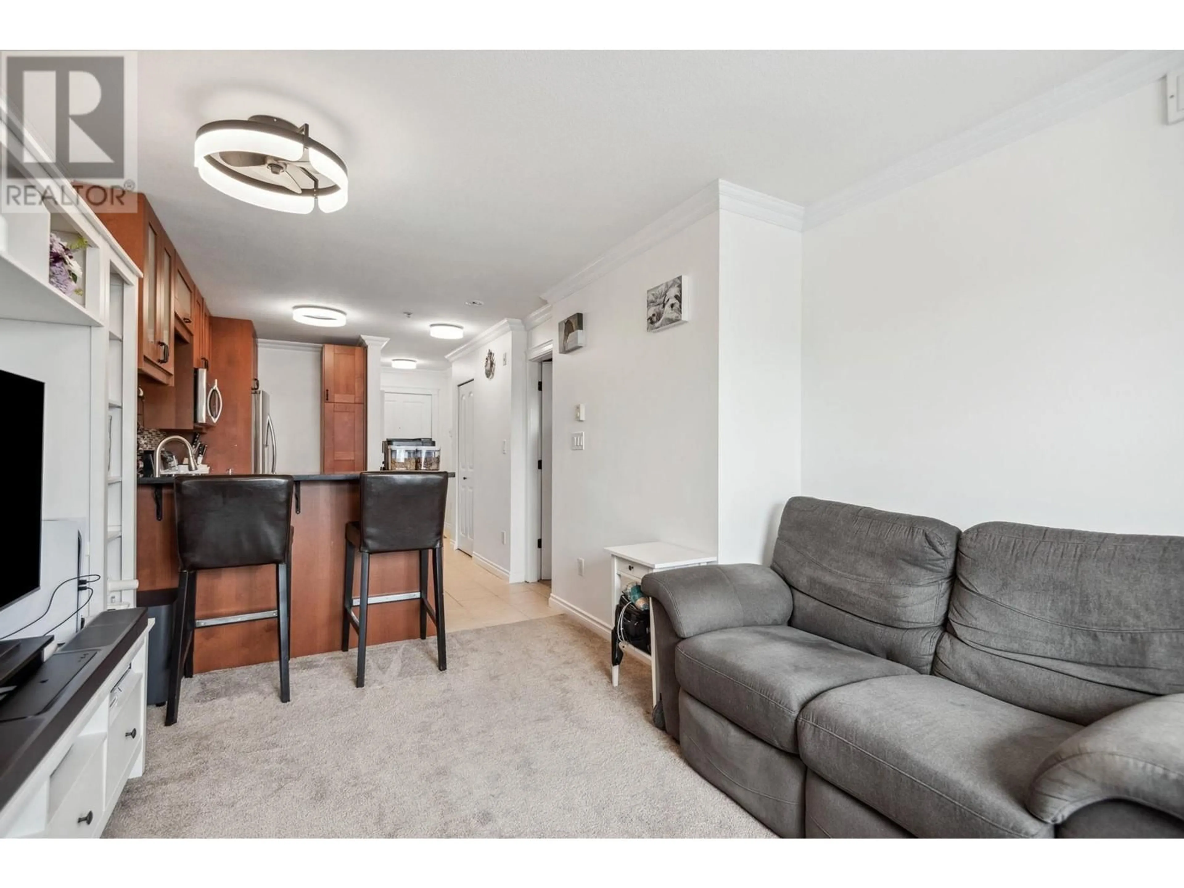 Living room with furniture, wood/laminate floor for 402 - 1990 DUNBAR STREET, Vancouver British Columbia V6R3M3