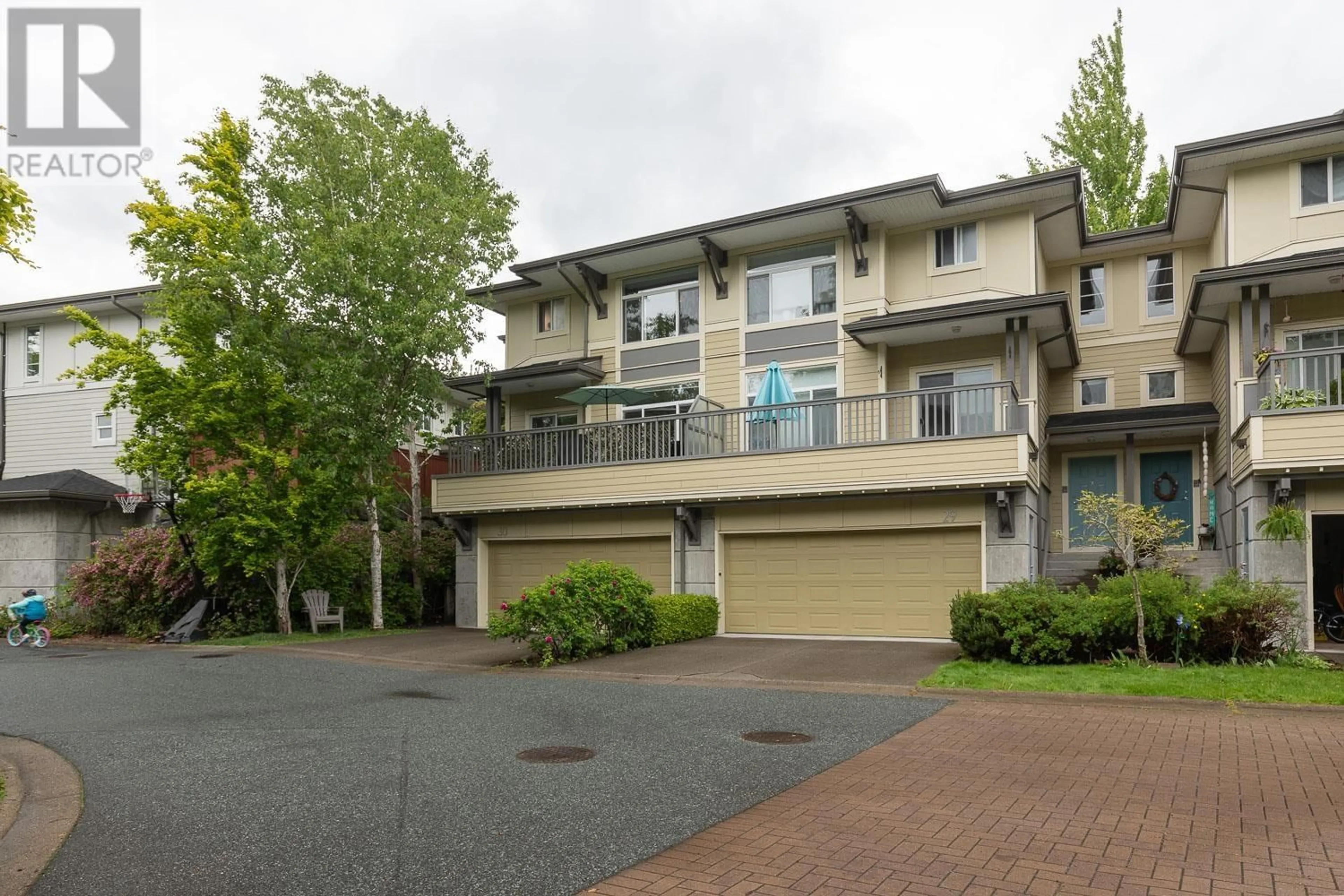 A pic from outside/outdoor area/front of a property/back of a property/a pic from drone, street for 30 - 40632 GOVERNMENT ROAD, Squamish British Columbia V8B0M7