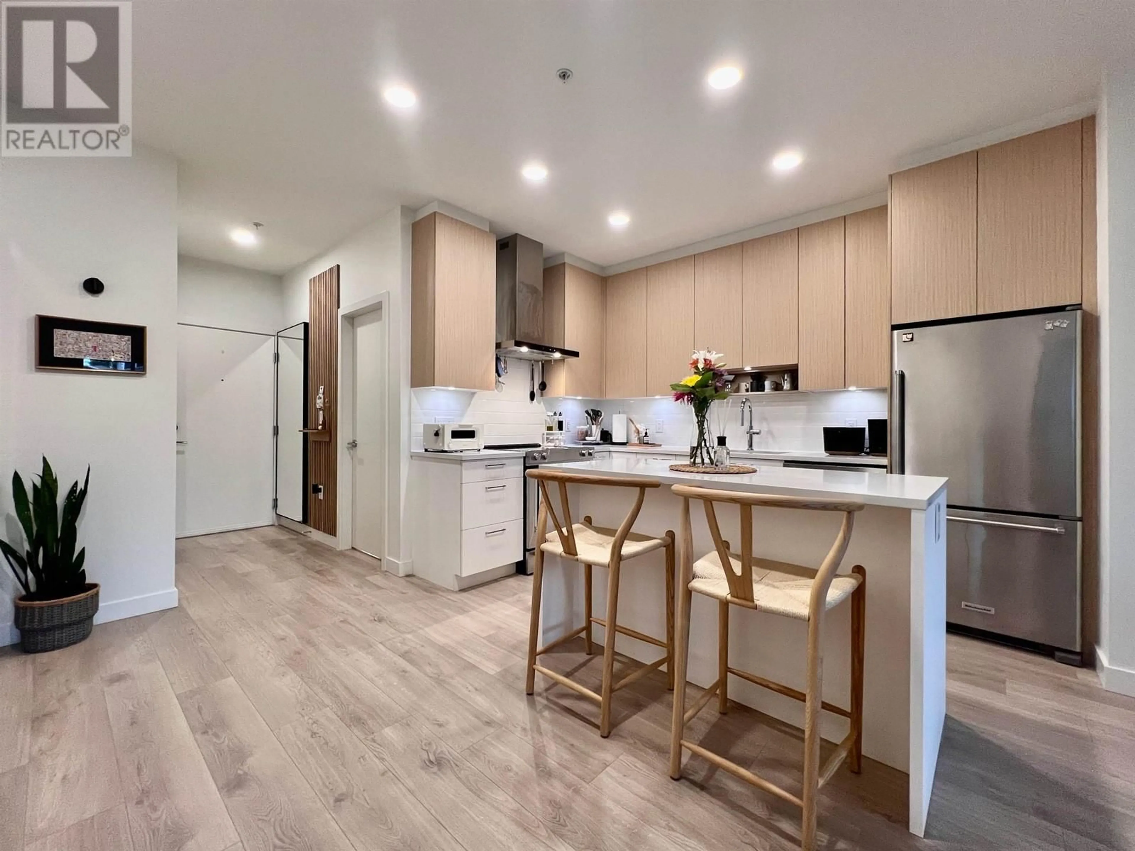 Open concept kitchen, wood/laminate floor for 106 - 7588 16TH STREET, Burnaby British Columbia V3N0H8