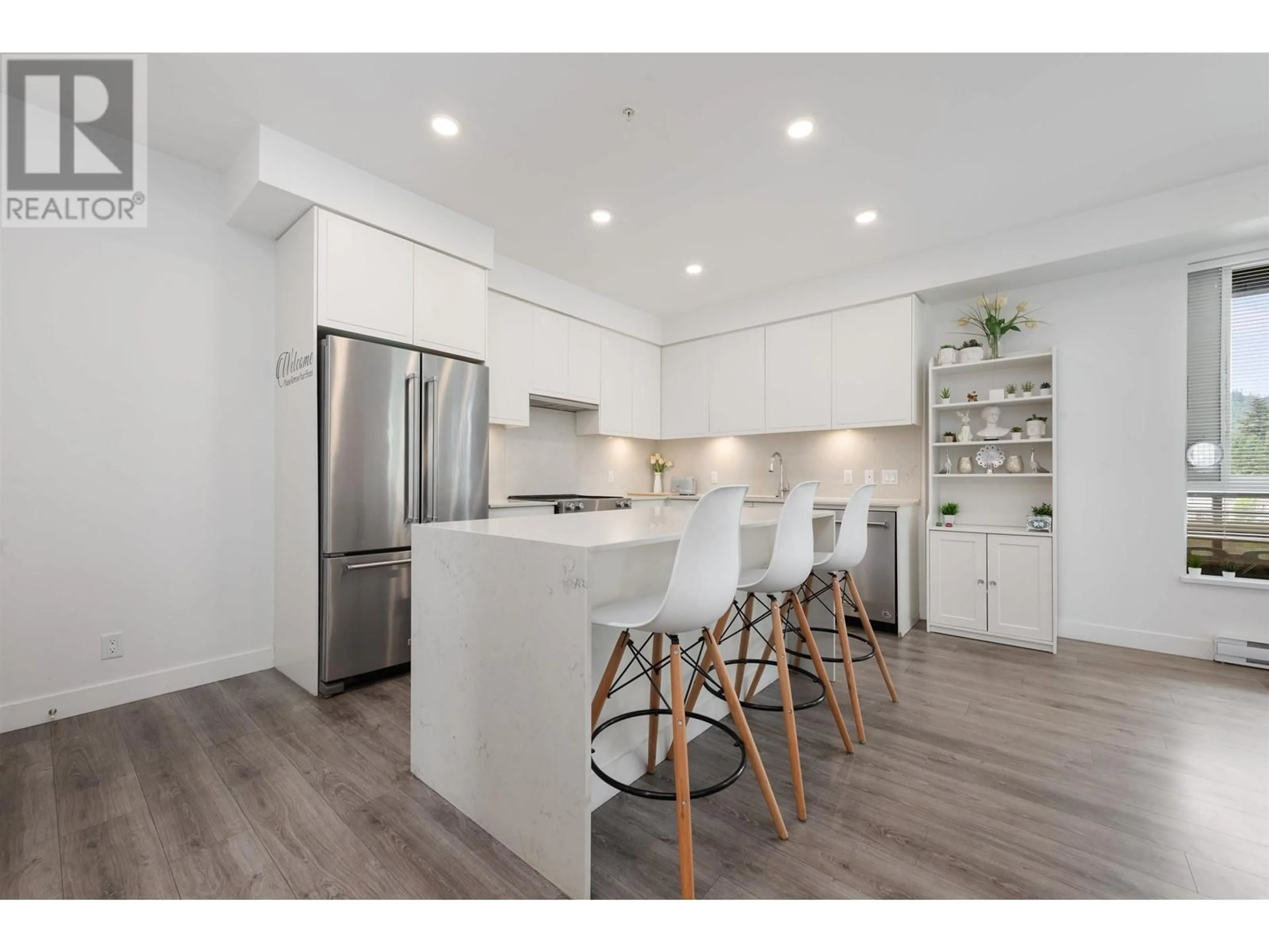 Open concept kitchen, wood/laminate floor for 313 - 700 CLARKE ROAD, Coquitlam British Columbia V3J0K5
