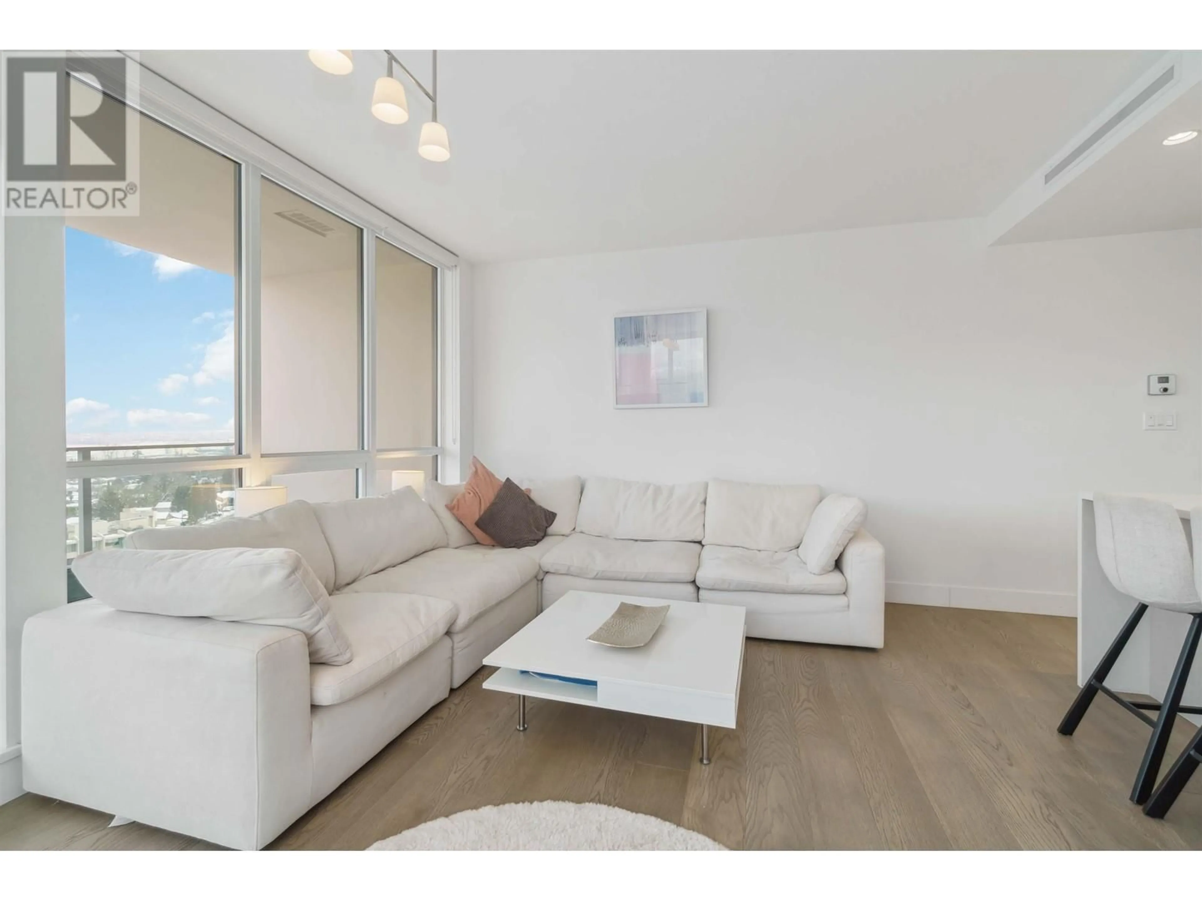 Living room with furniture, wood/laminate floor for 1401 - 1632 LIONS GATE LANE, North Vancouver British Columbia V7P0E2