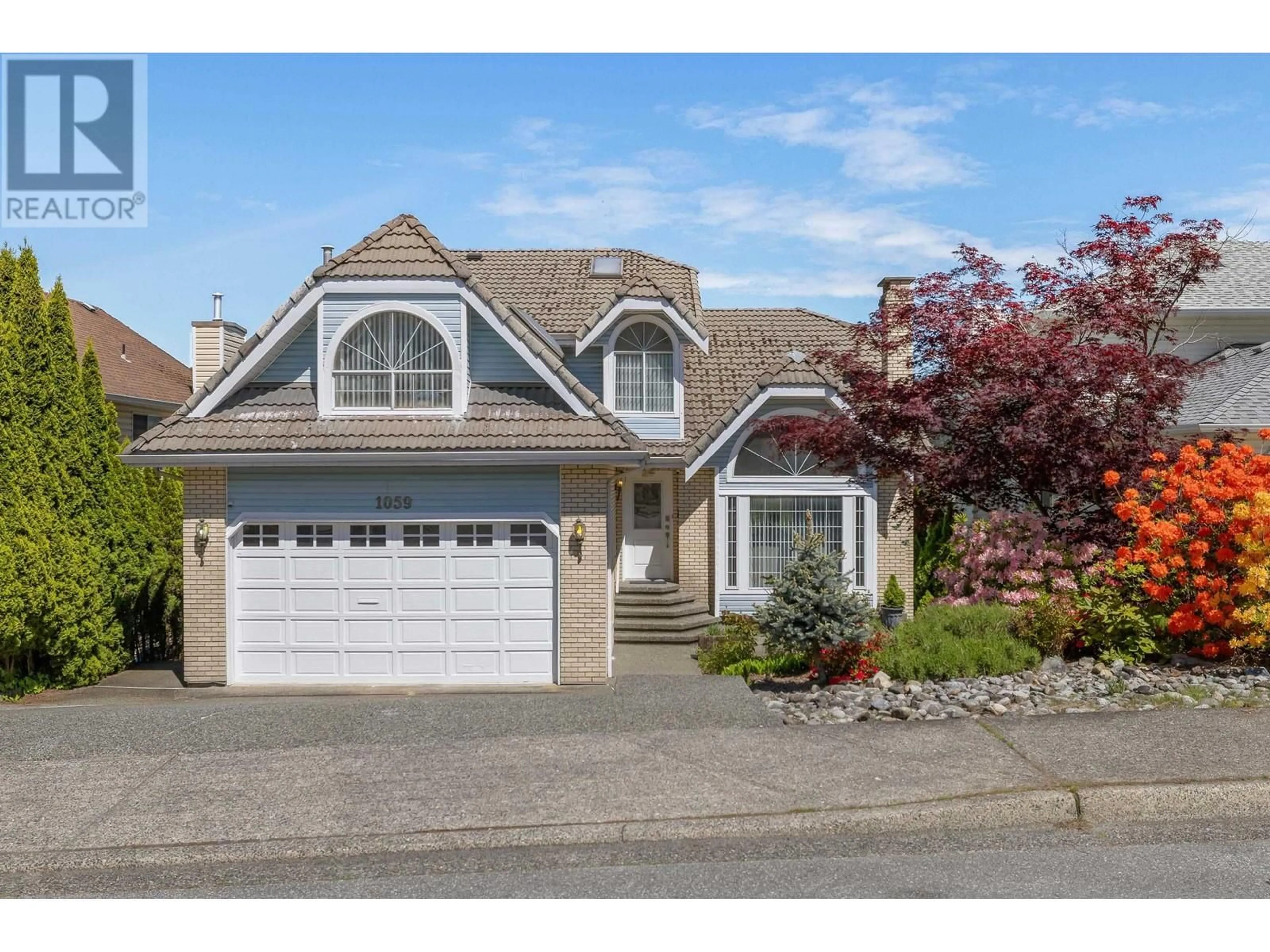 Home with vinyl exterior material, street for 1059 WINDWARD DRIVE, Coquitlam British Columbia V3C4M5