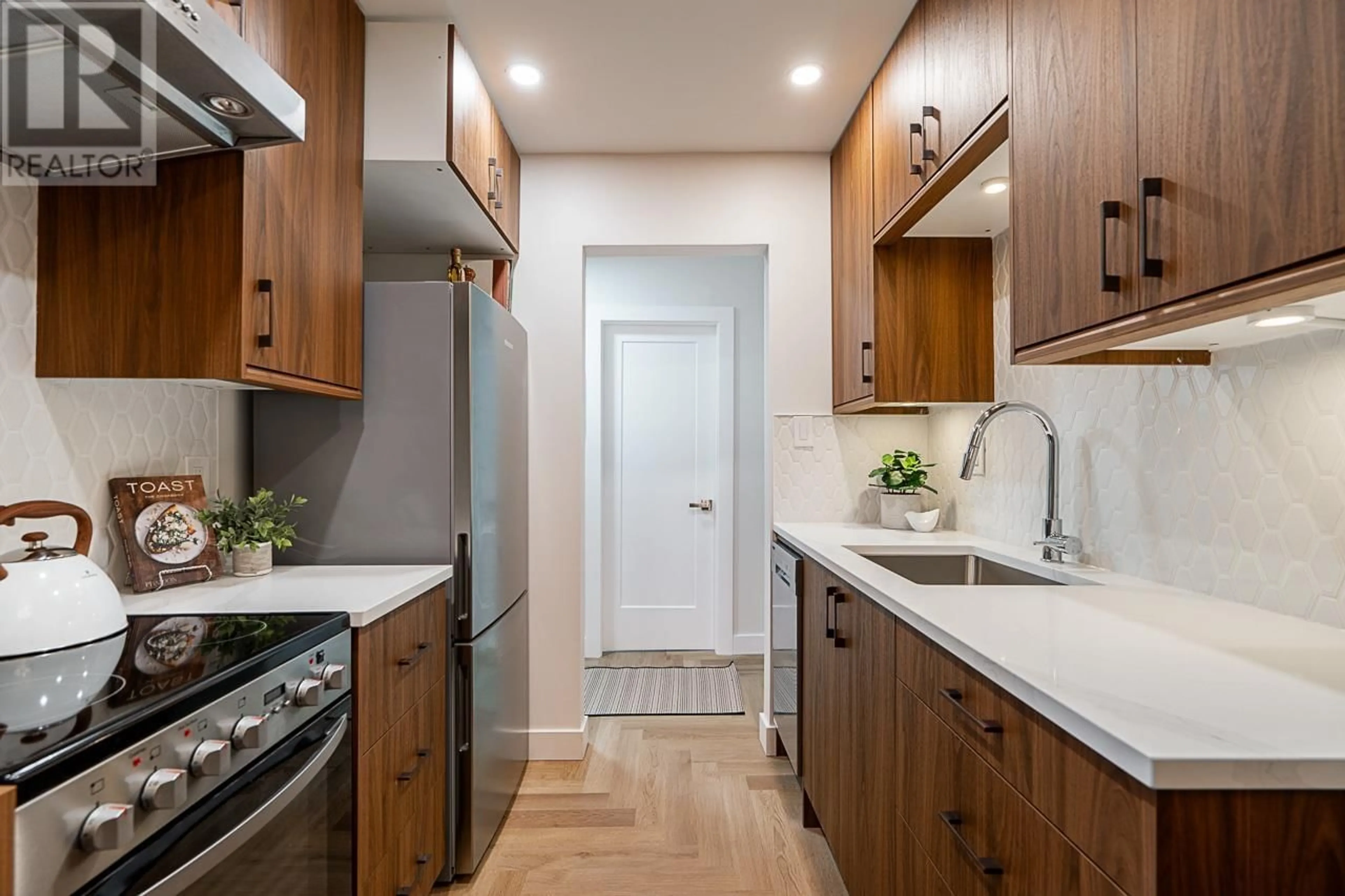 Contemporary kitchen, wood/laminate floor for 207 - 1717 13TH AVENUE, Vancouver British Columbia V6J2H2