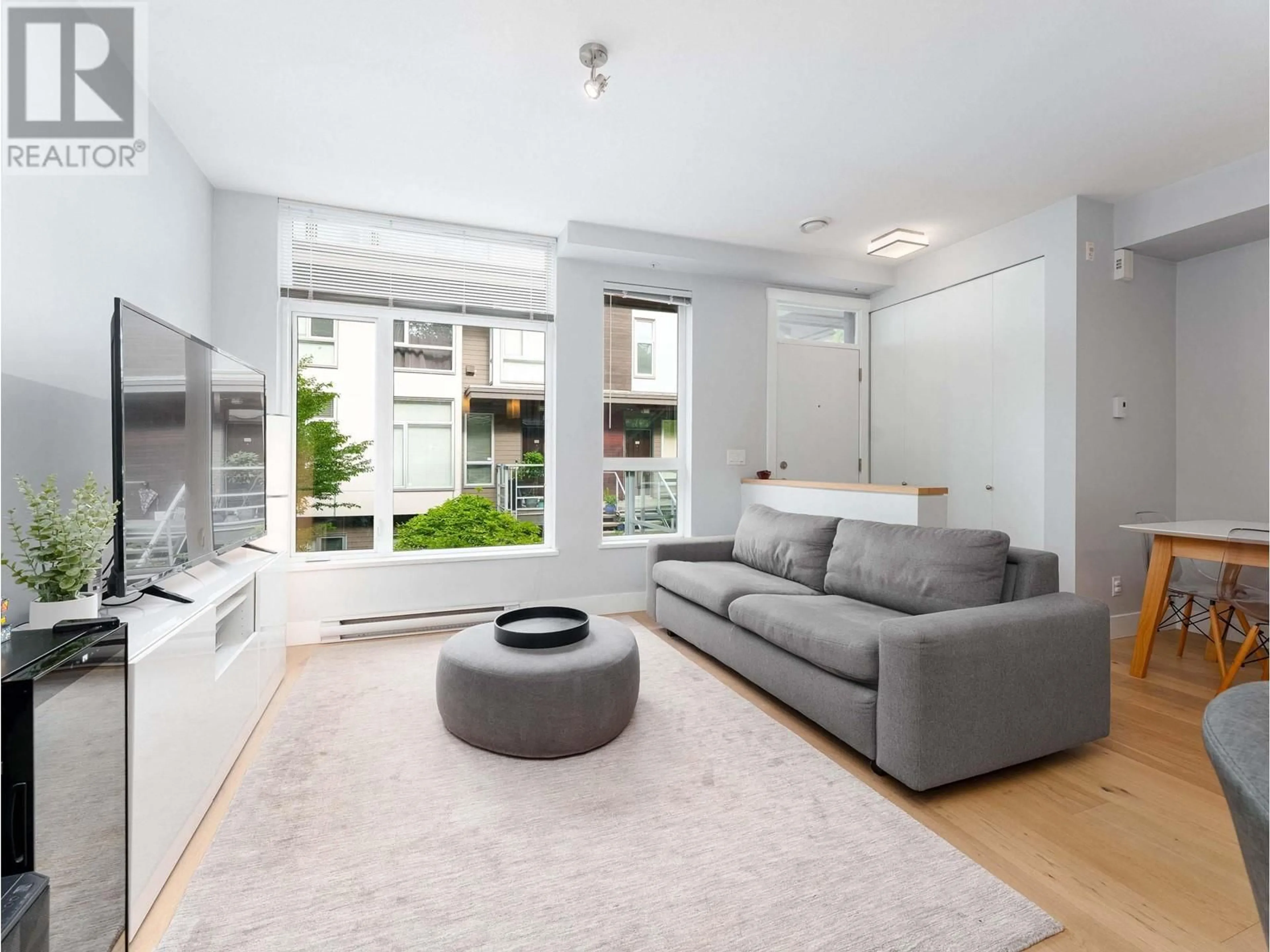 Living room with furniture, unknown for 223 - 735 15TH STREET, North Vancouver British Columbia V7M0B8
