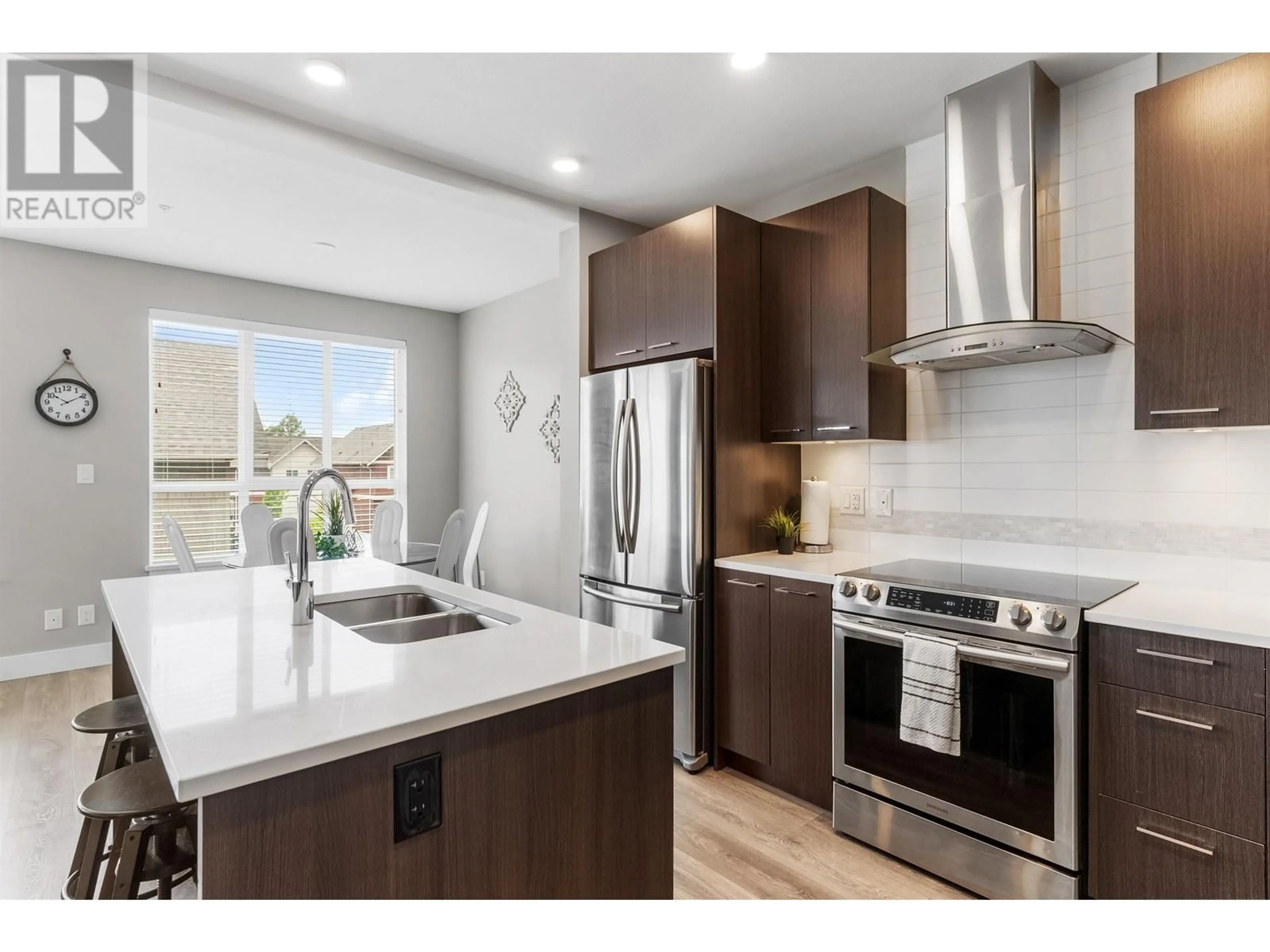 Open concept kitchen, wood/laminate floor for 317 - 4690 HAWK LANE, Tsawwassen British Columbia V4M0C4