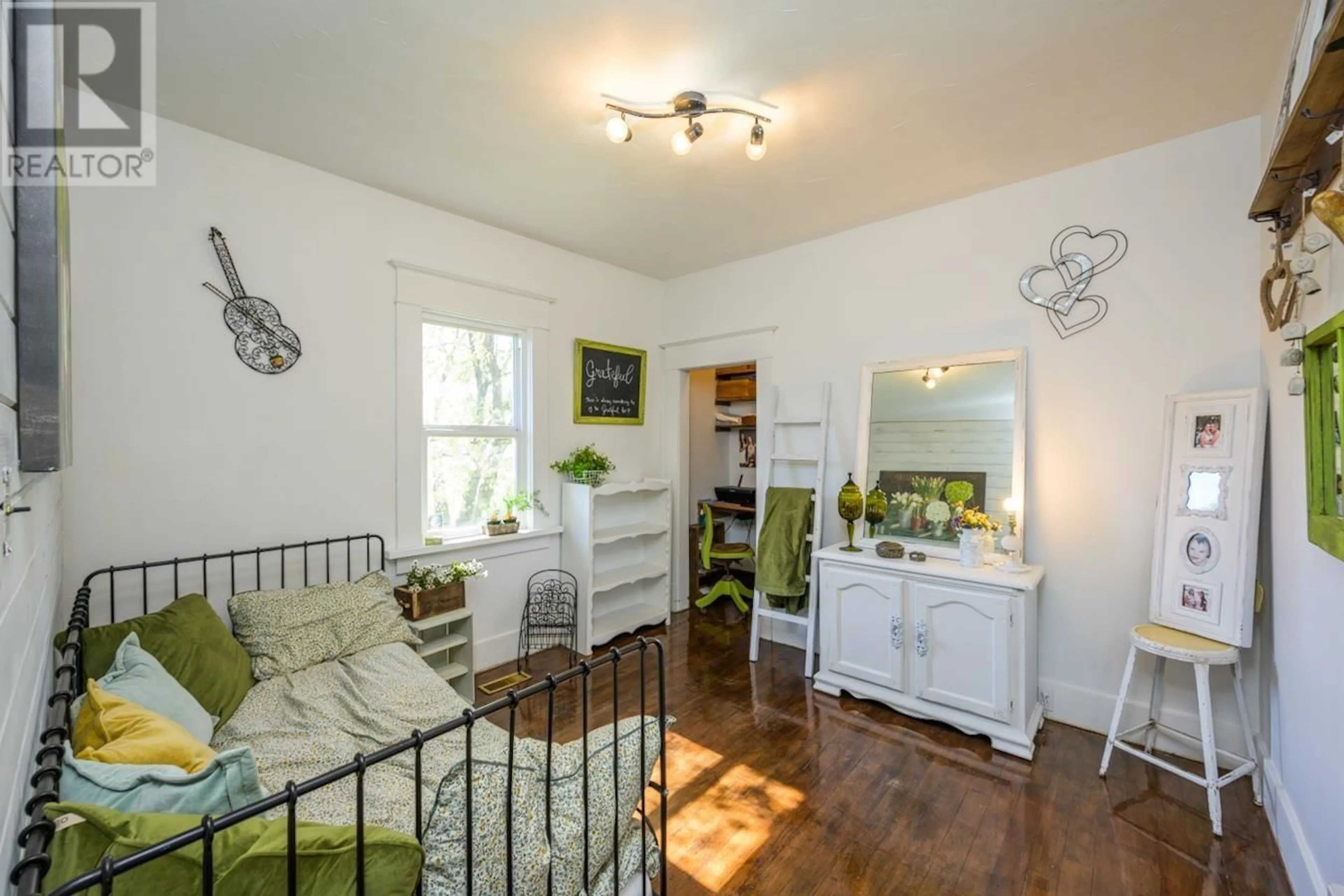 Living room with furniture, wood/laminate floor for 1787 7TH AVENUE, Prince George British Columbia V2L3P7