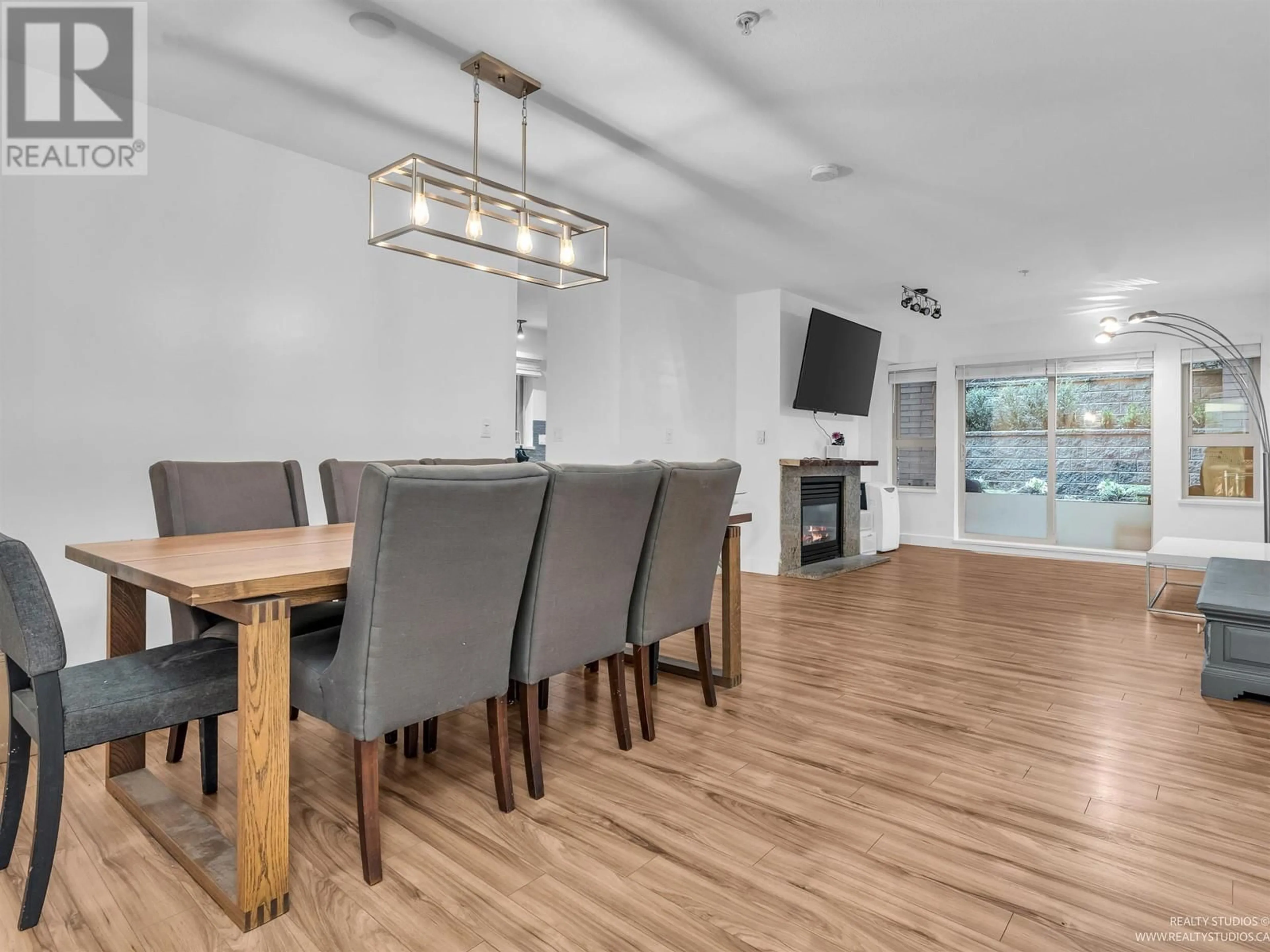 Dining room, wood/laminate floor for 104 - 9329 UNIVERSITY CRESCENT, Burnaby British Columbia V5A4Y4